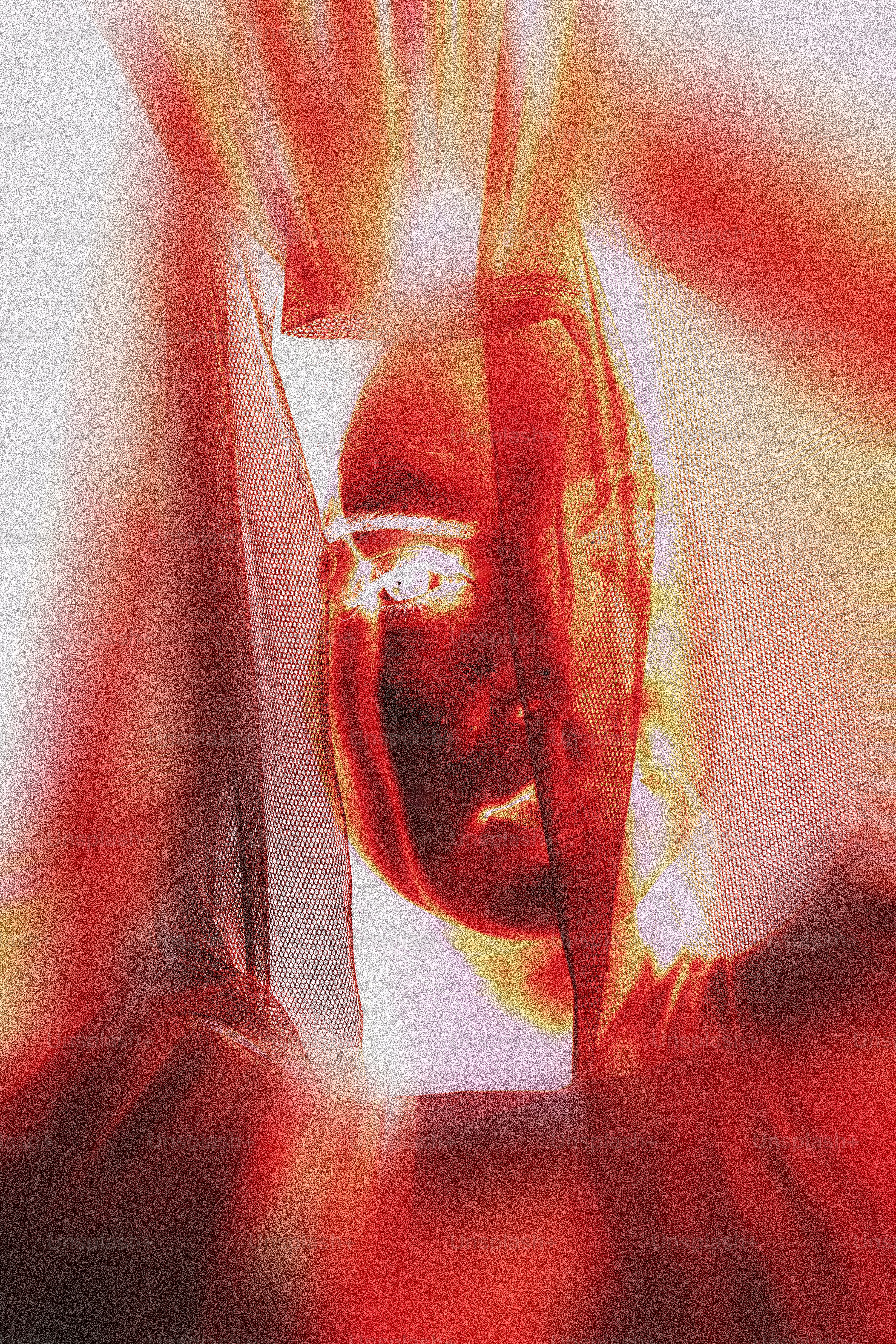 A blurry image of a person holding a cell phone