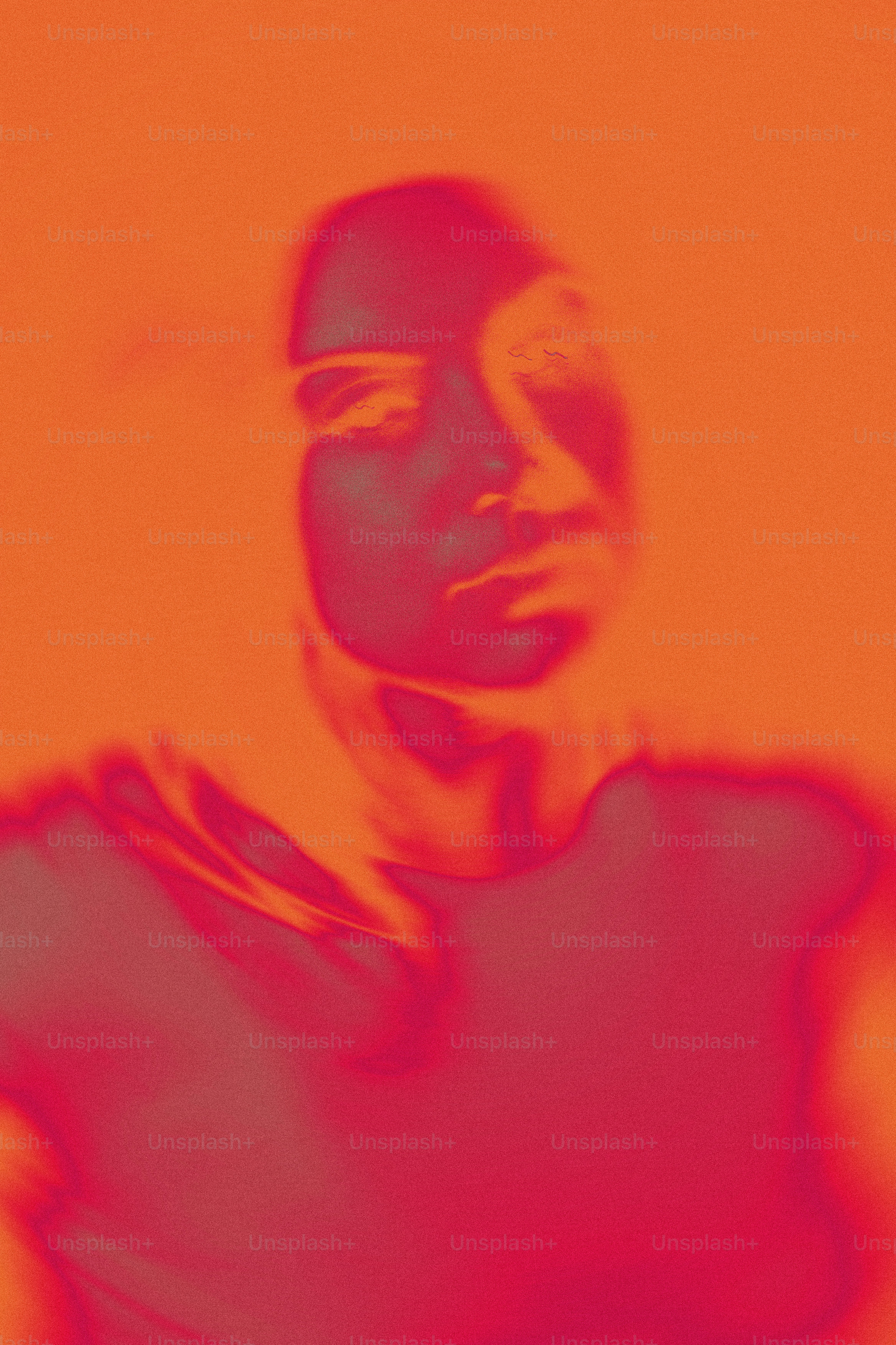 A man in a black shirt with a red background