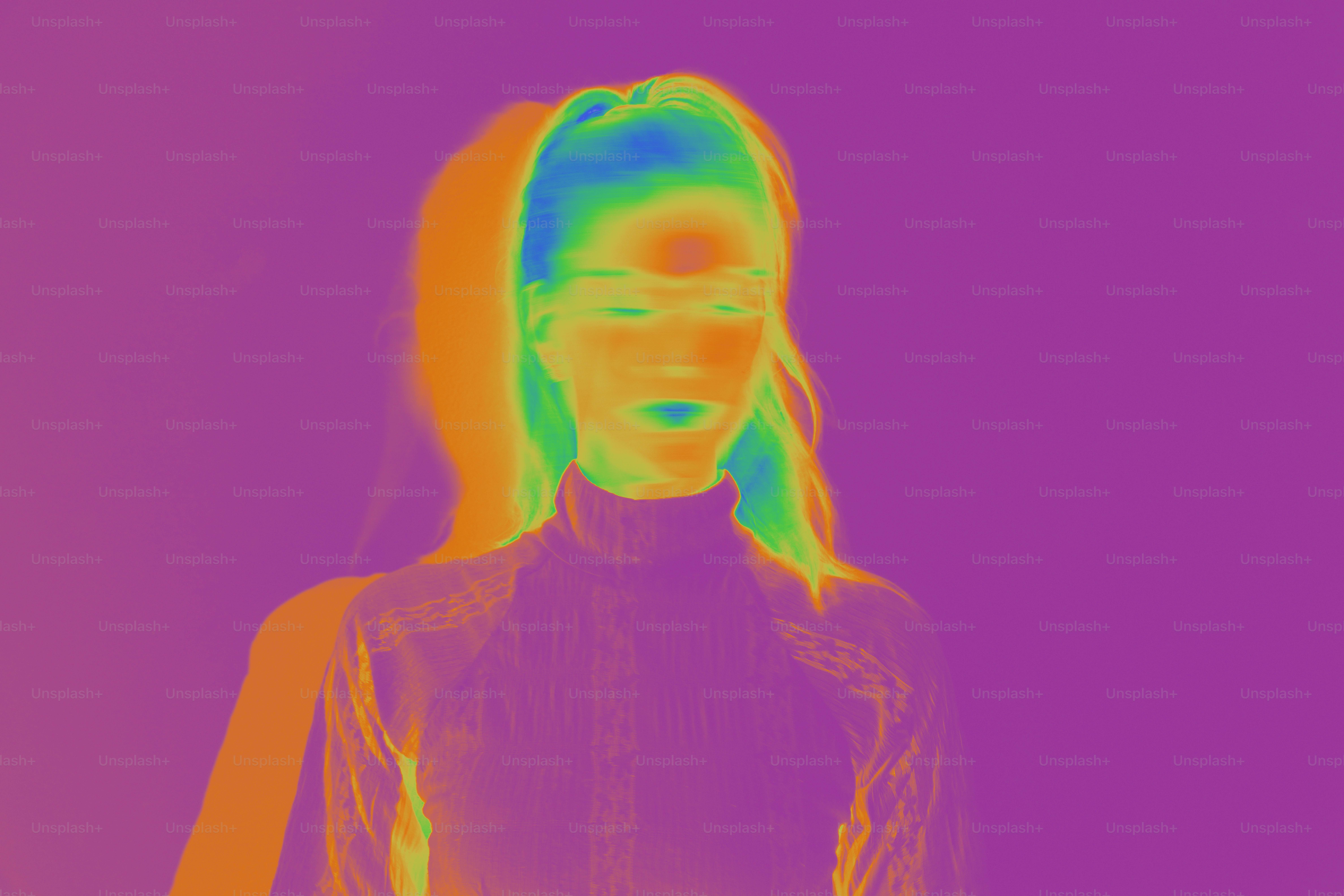 A woman standing in front of a purple background