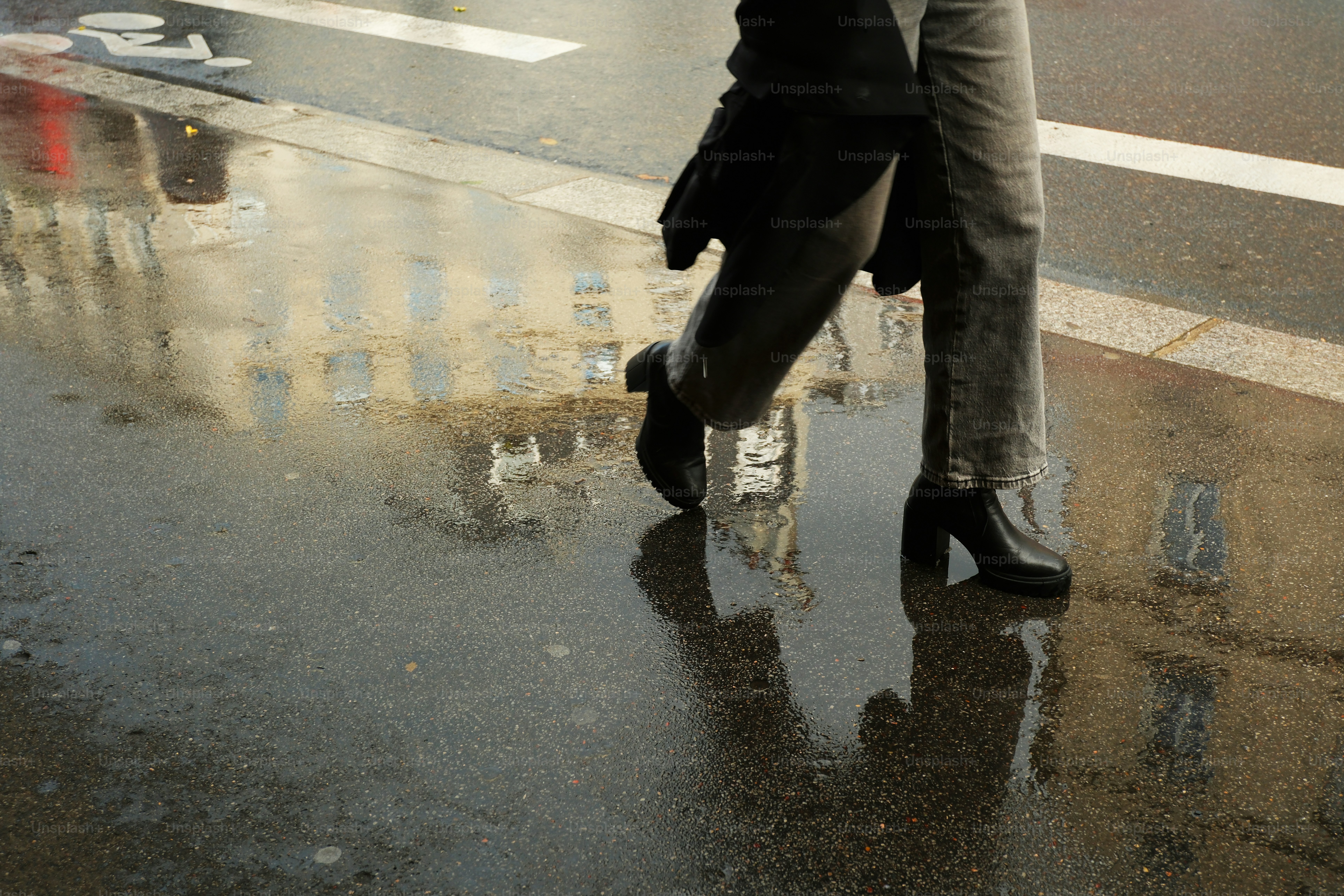 A man and a woman kissing in the rain