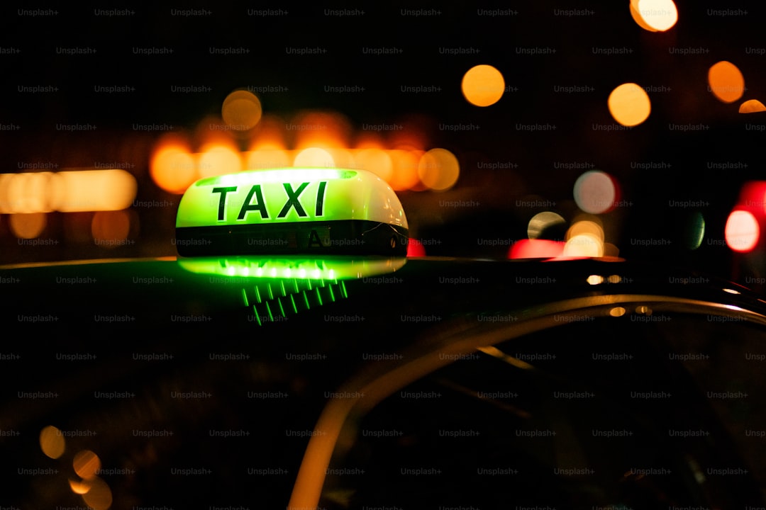 A taxi cab that is sitting in the street