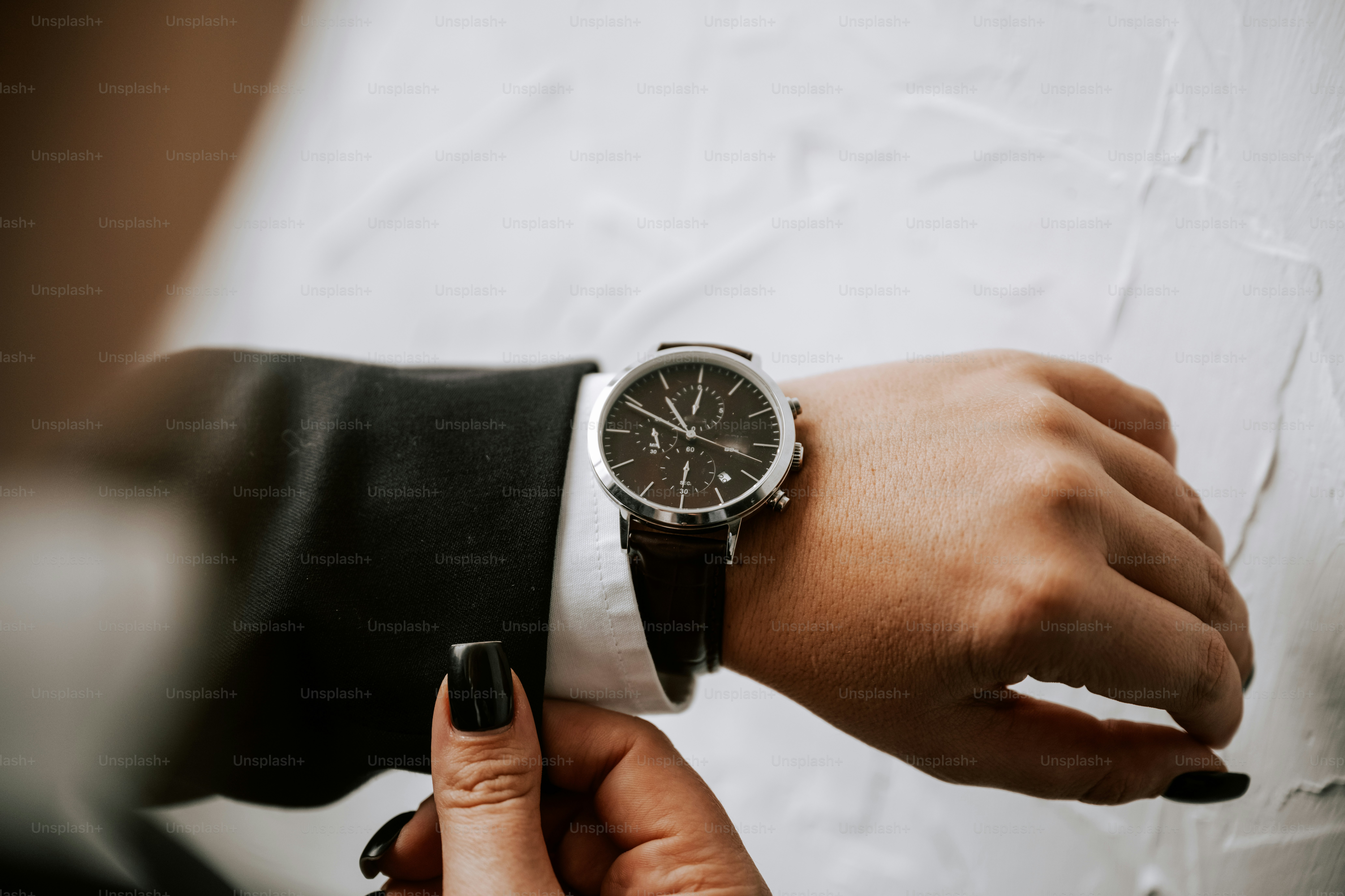 A person wearing a watch on their wrist