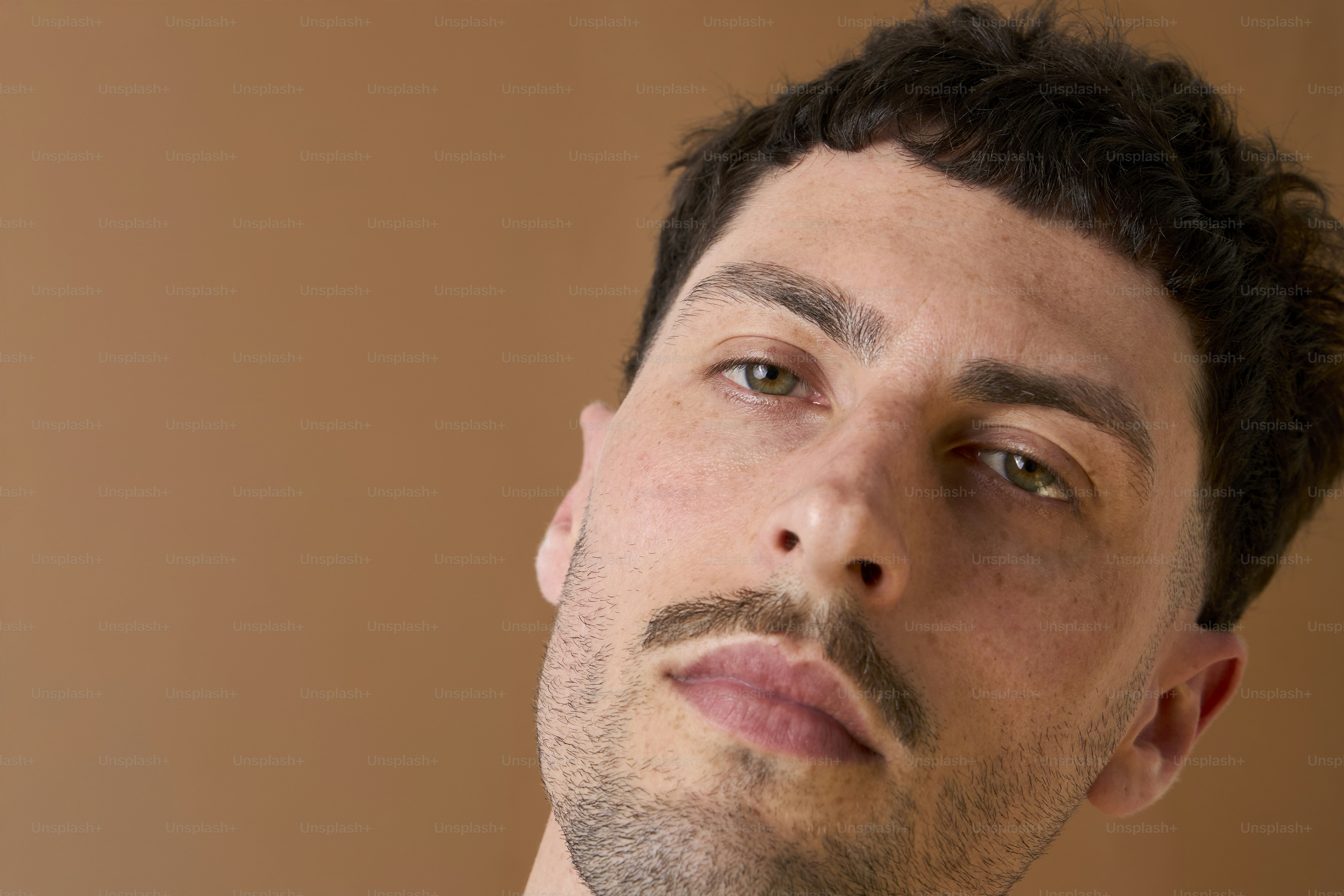 A man in a suit and tie looking off into the distance
