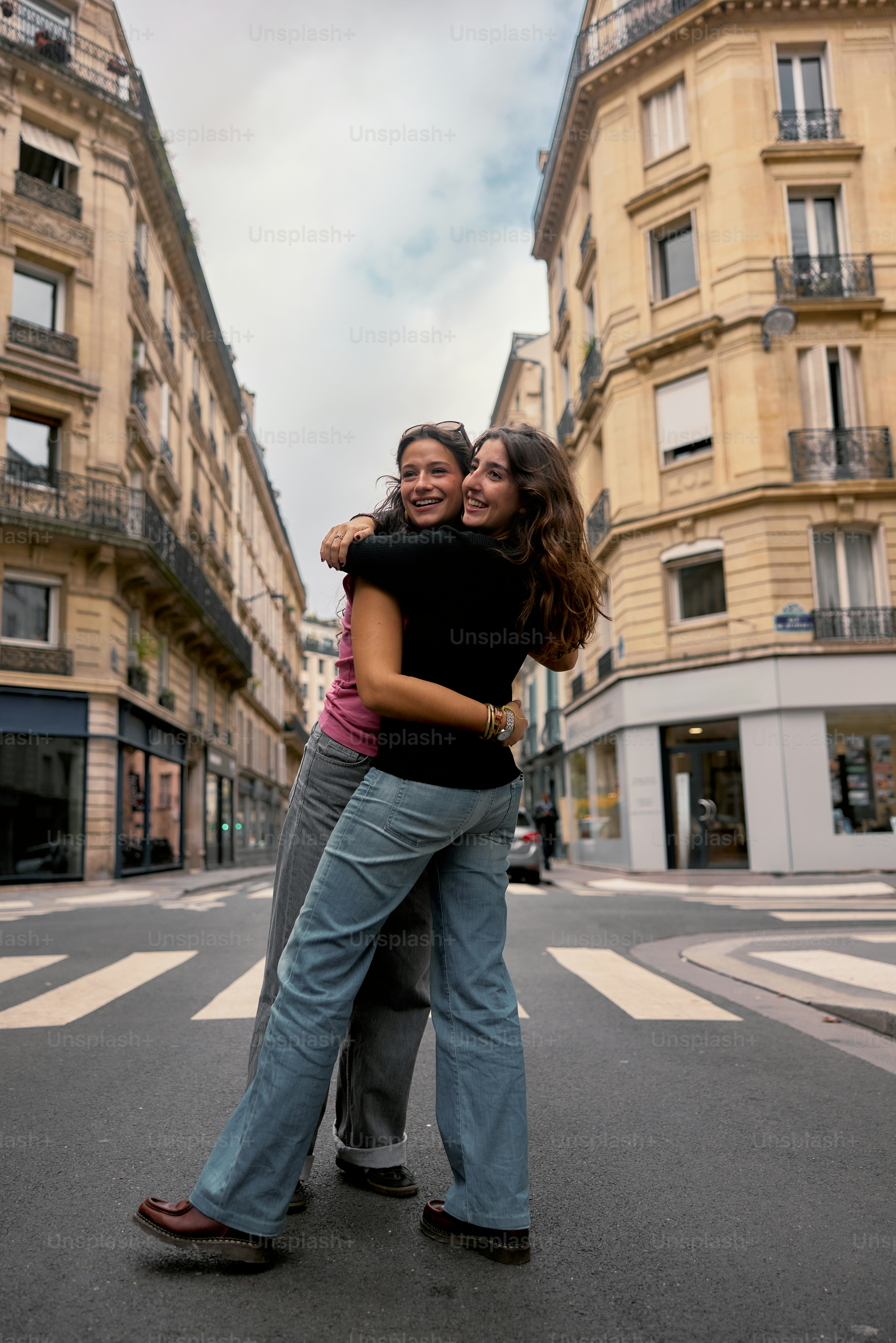 A couple of people that are standing in the street