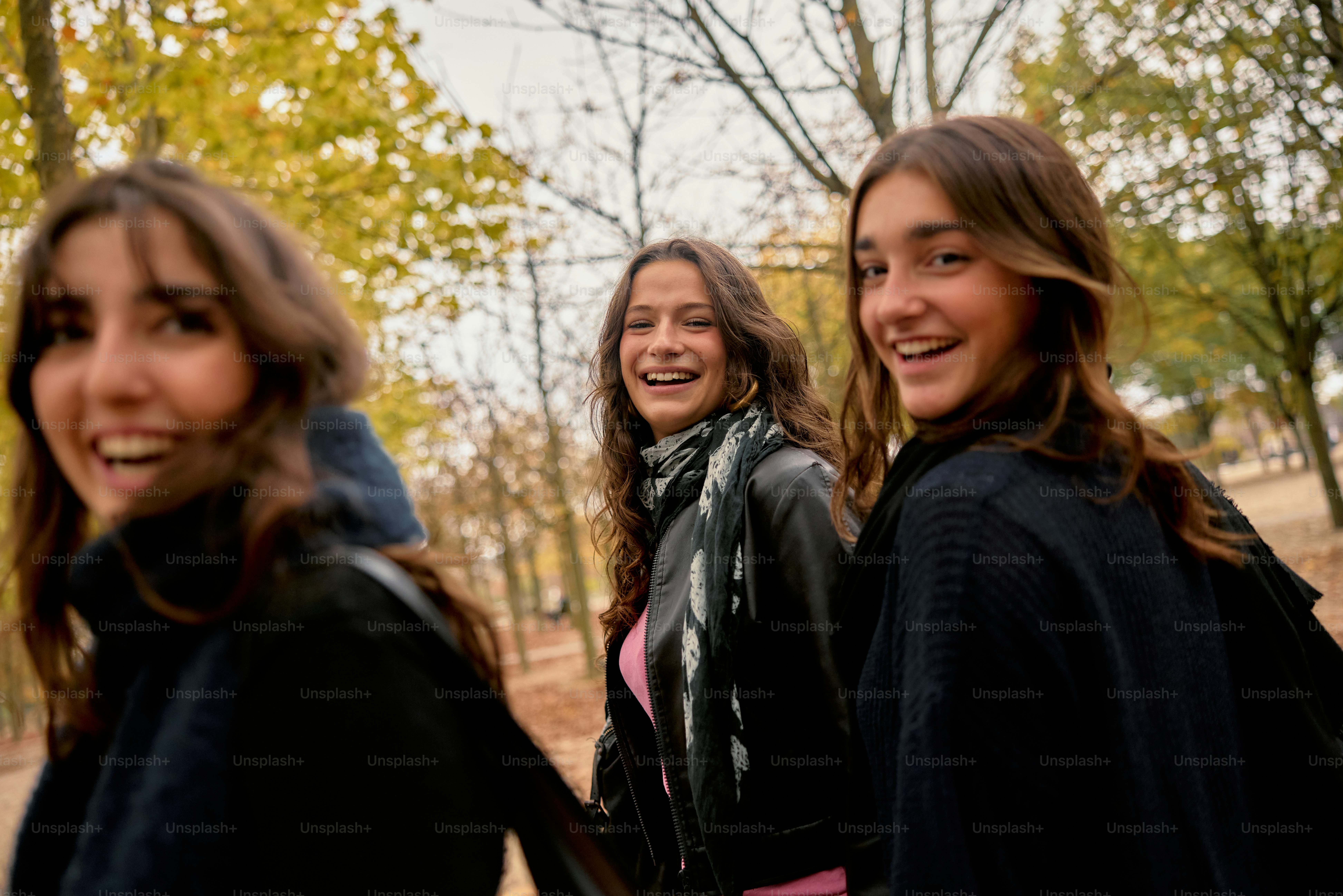 A group of young women standing next to each other