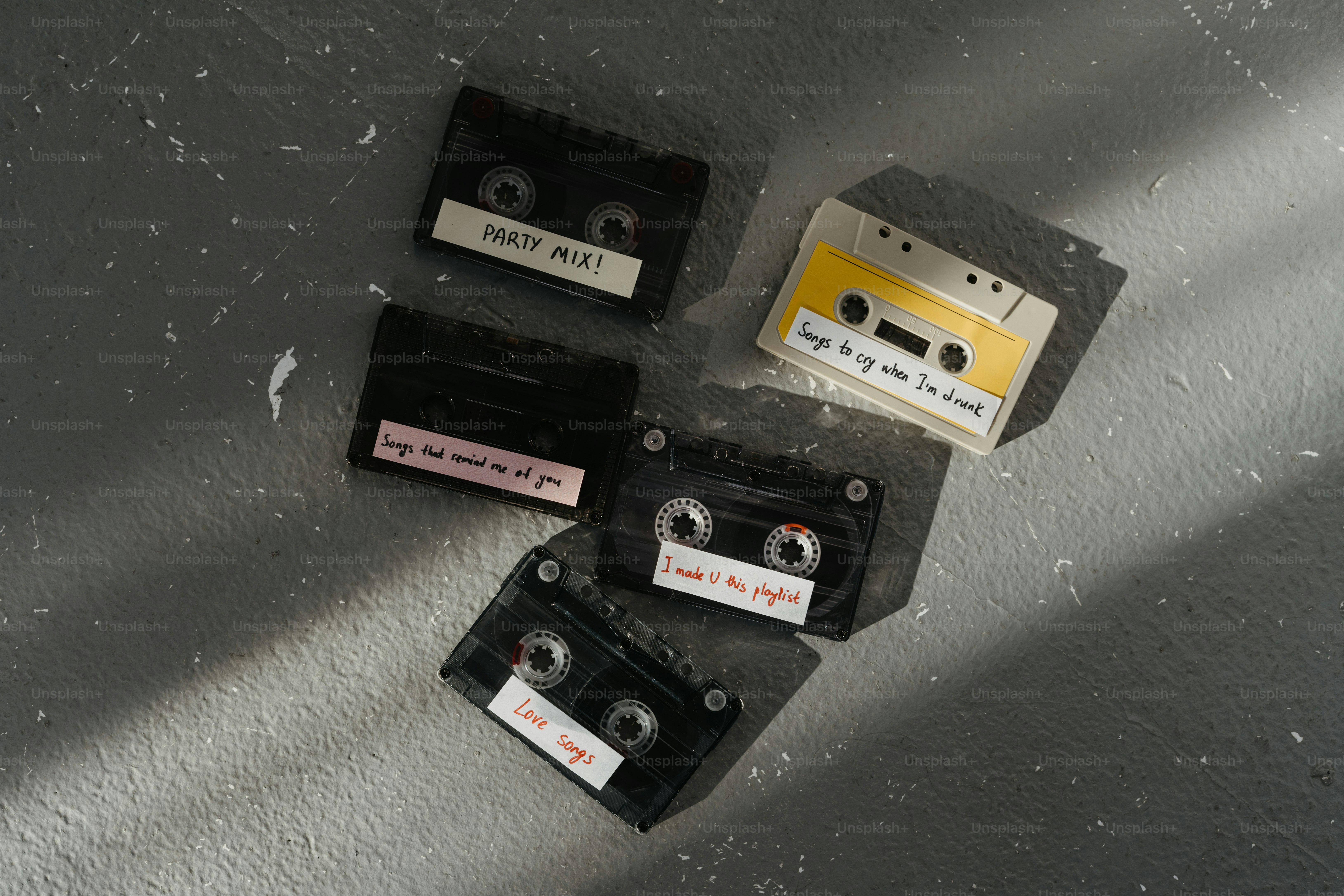 A group of cassettes sitting on top of a table