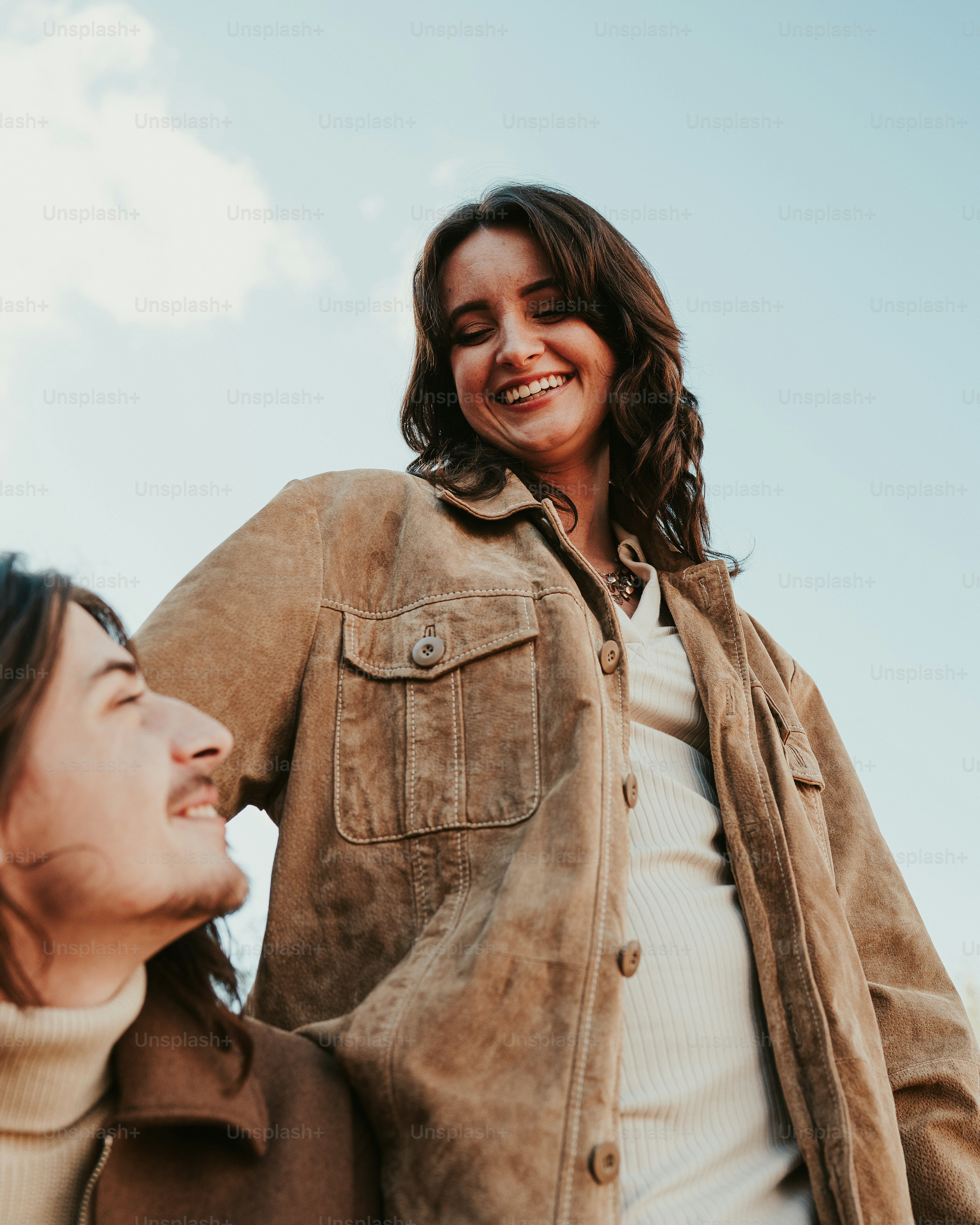 A man holding a woman's hand and smiling