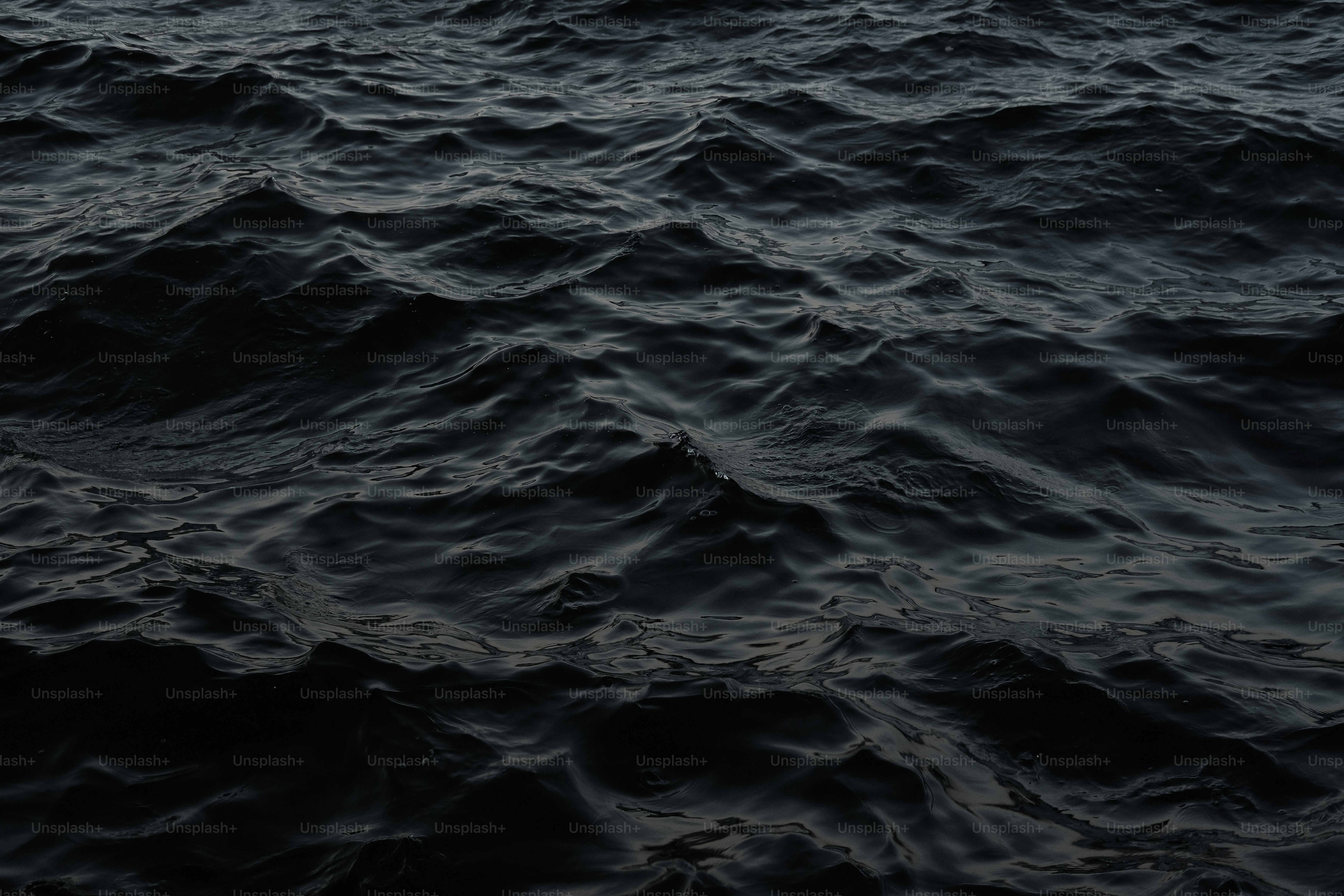 A large body of water with a boat in the distance