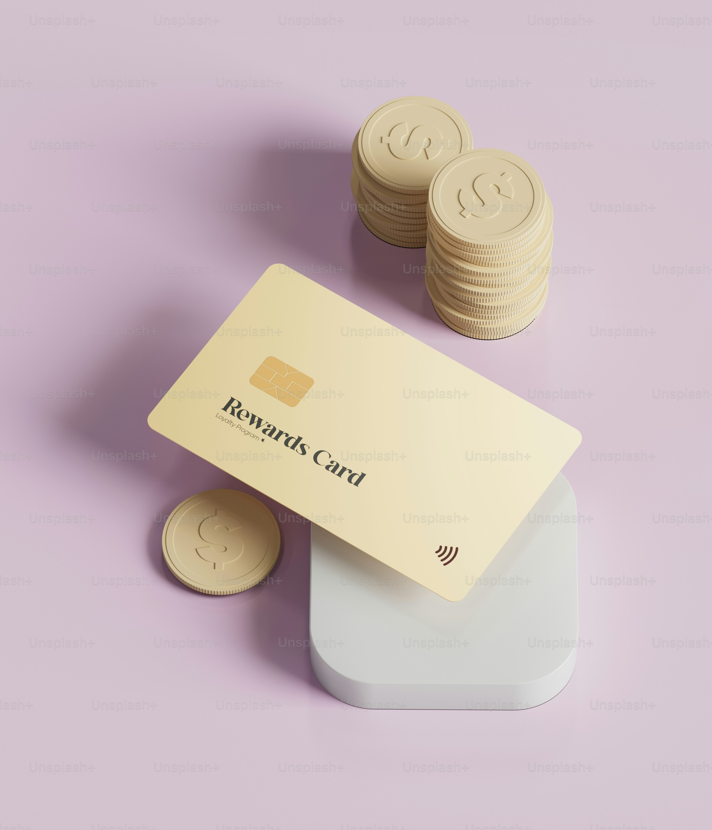 A stack of coins sitting next to a business card