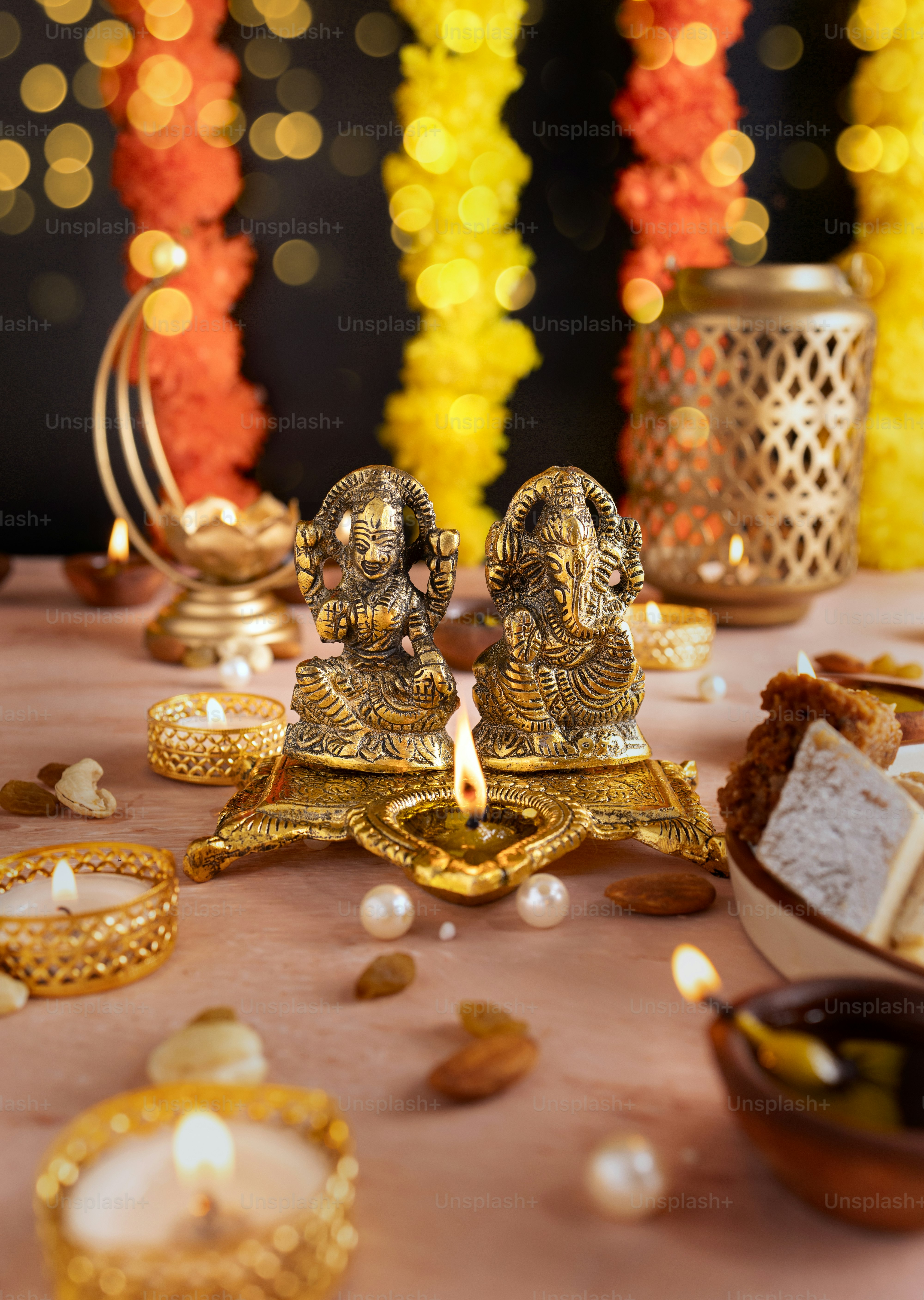 A table topped with lots of food and candles