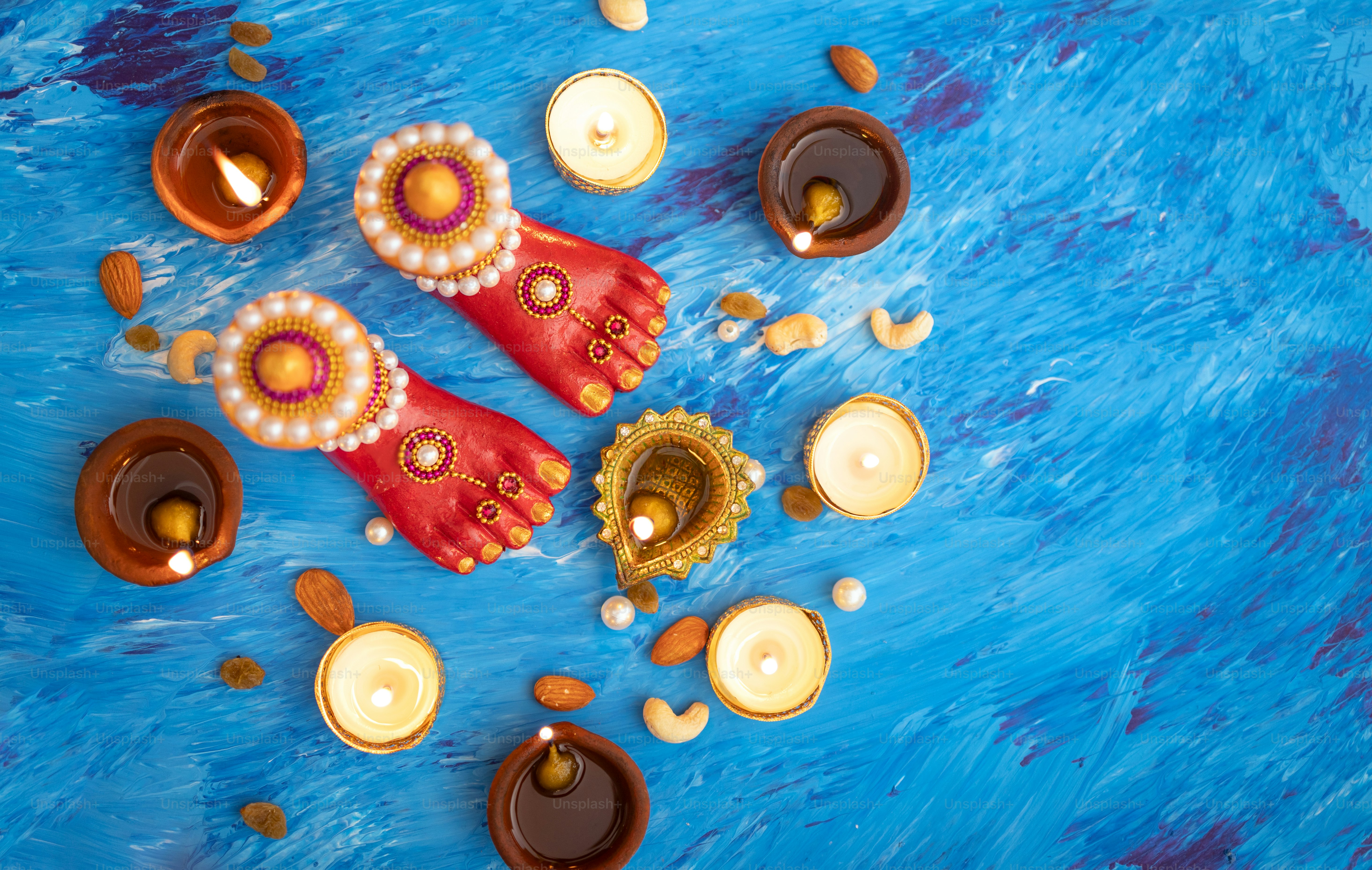 A painting of a pair of red shoes on a blue surface