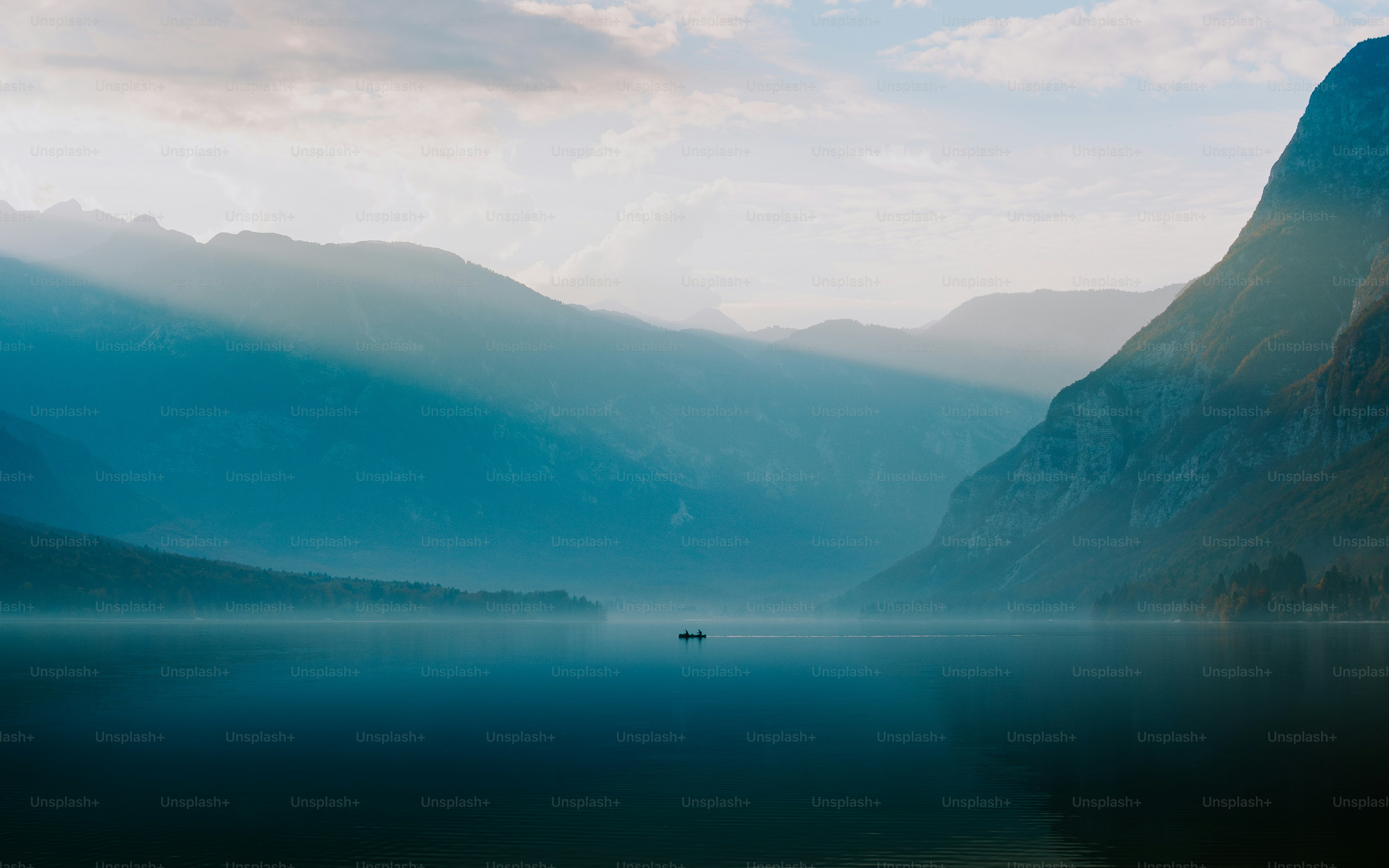 a-large-body-of-water-surrounded-by-mountains-photo-wallpaper-4k