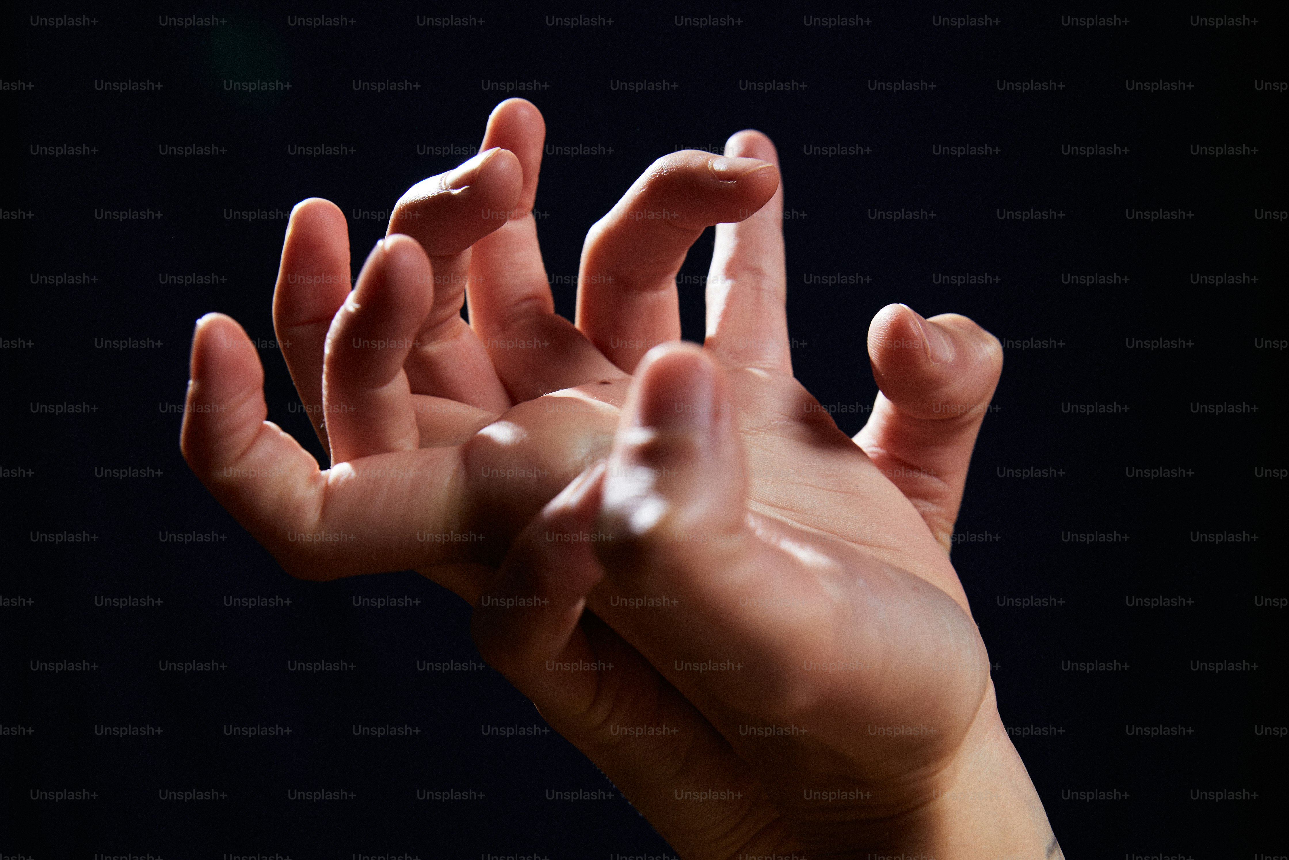 A person holding their hands up in the air