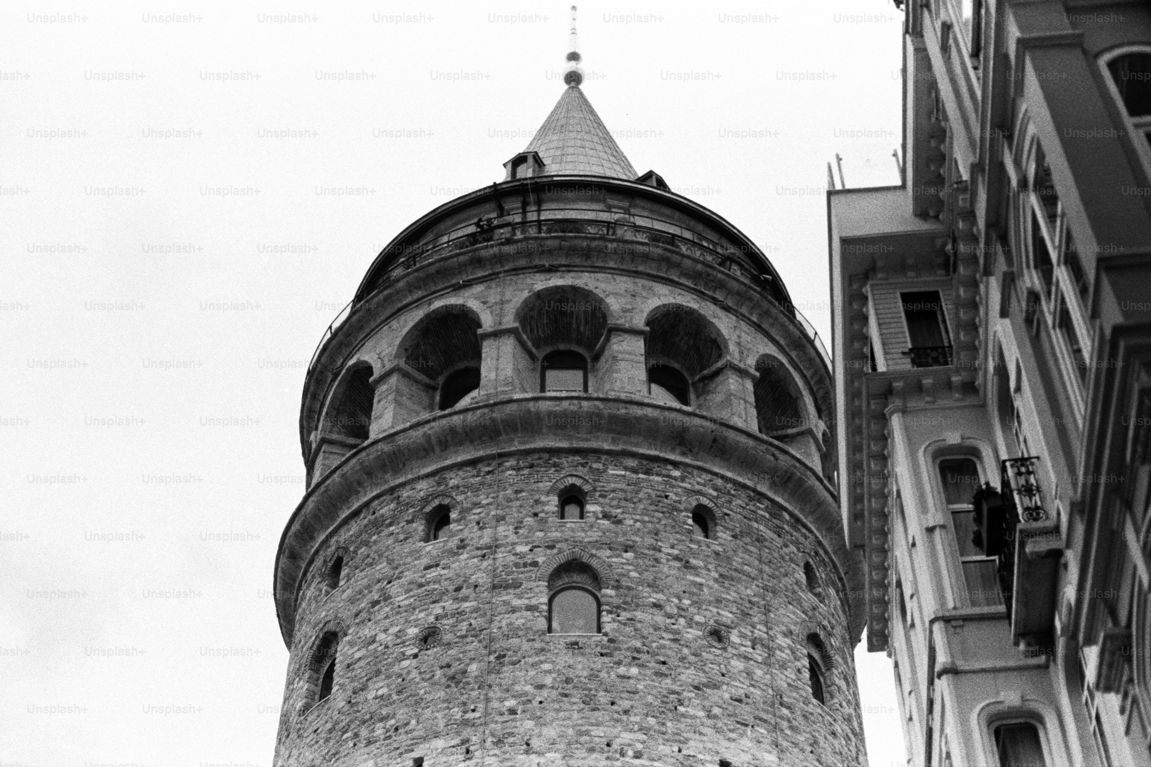 A black and white photo of a clock tower