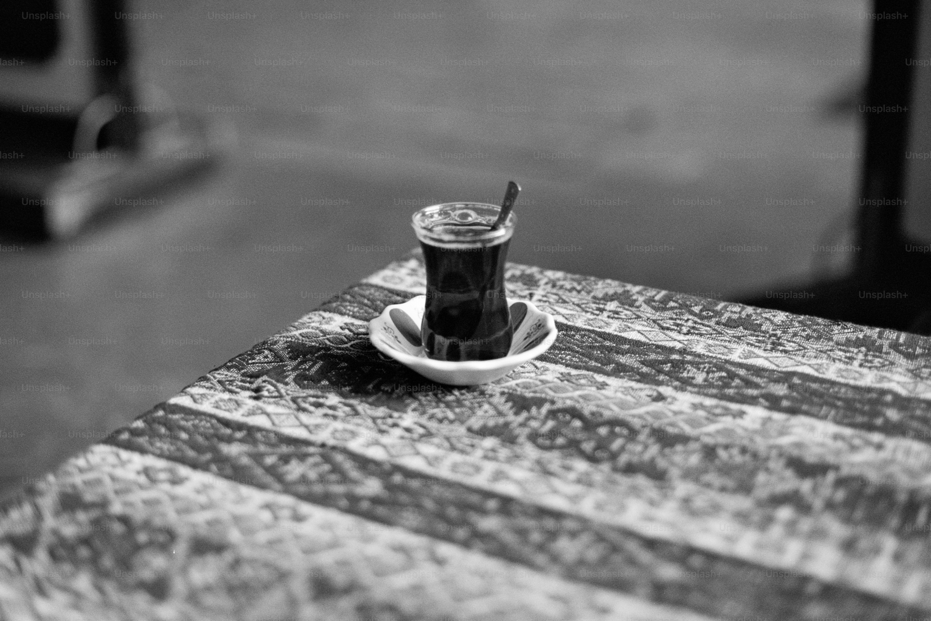 A coffee cup sitting on top of a wooden table