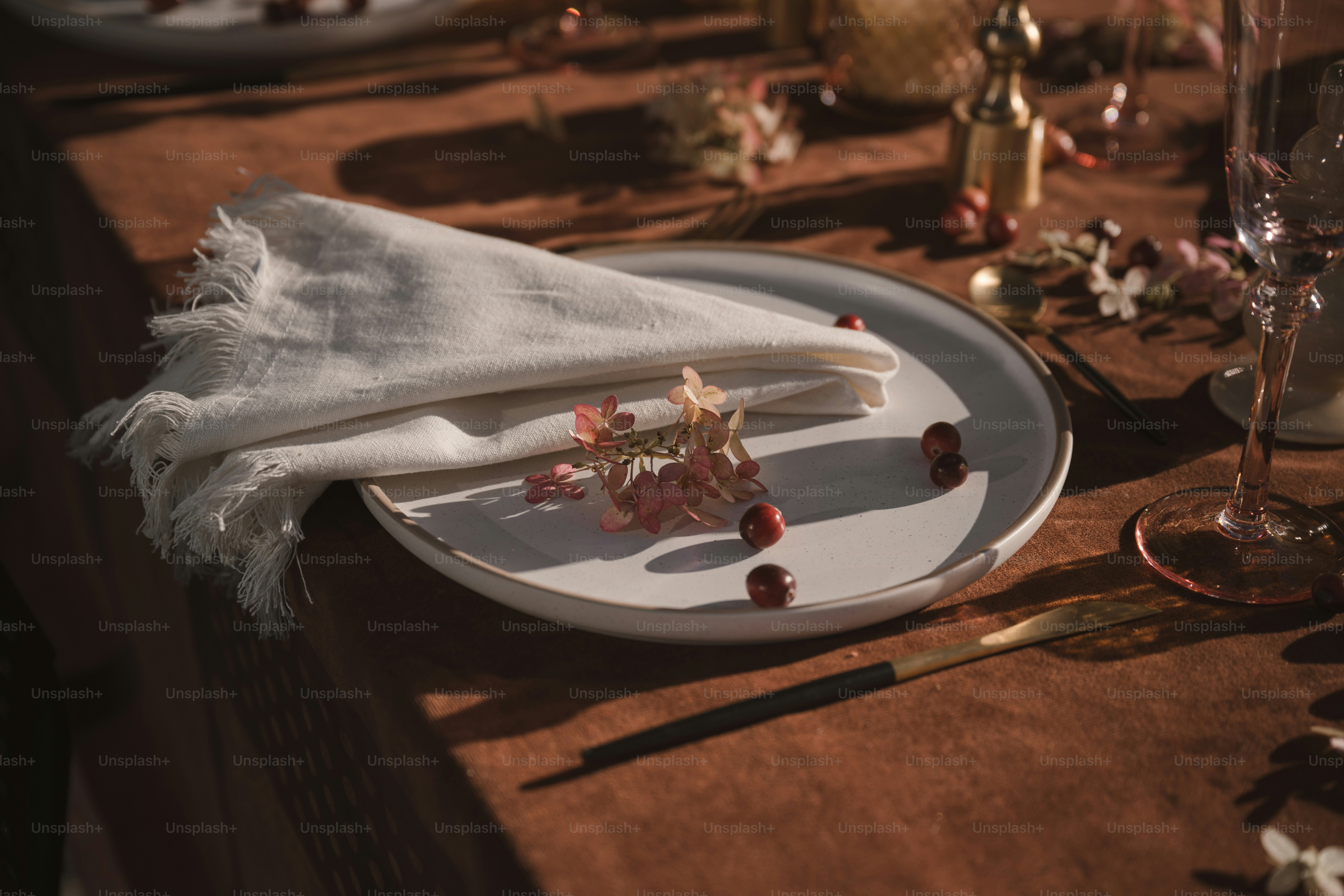 A white plate topped with a piece of cake on top of a table
