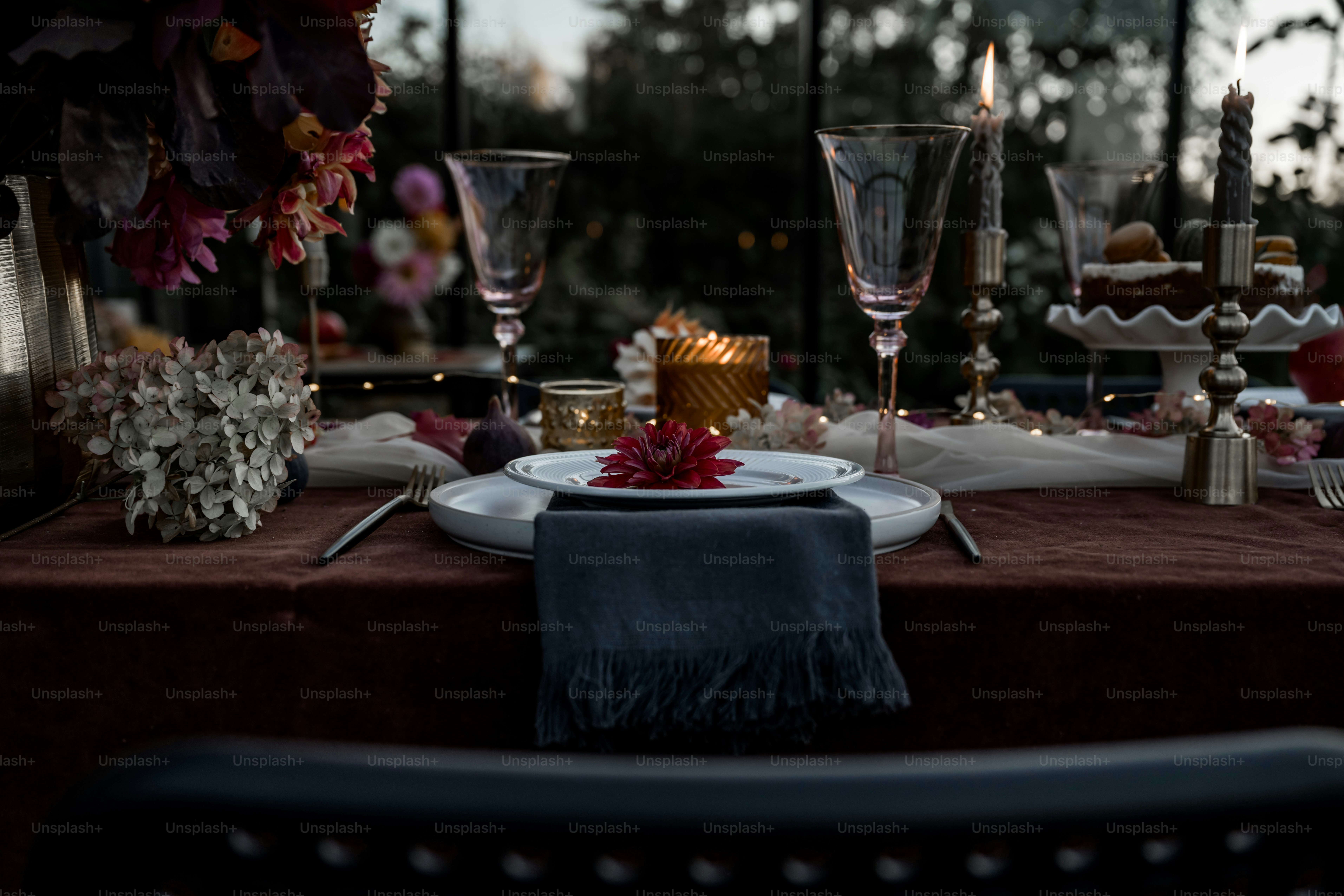 A table is set with a cake and candles