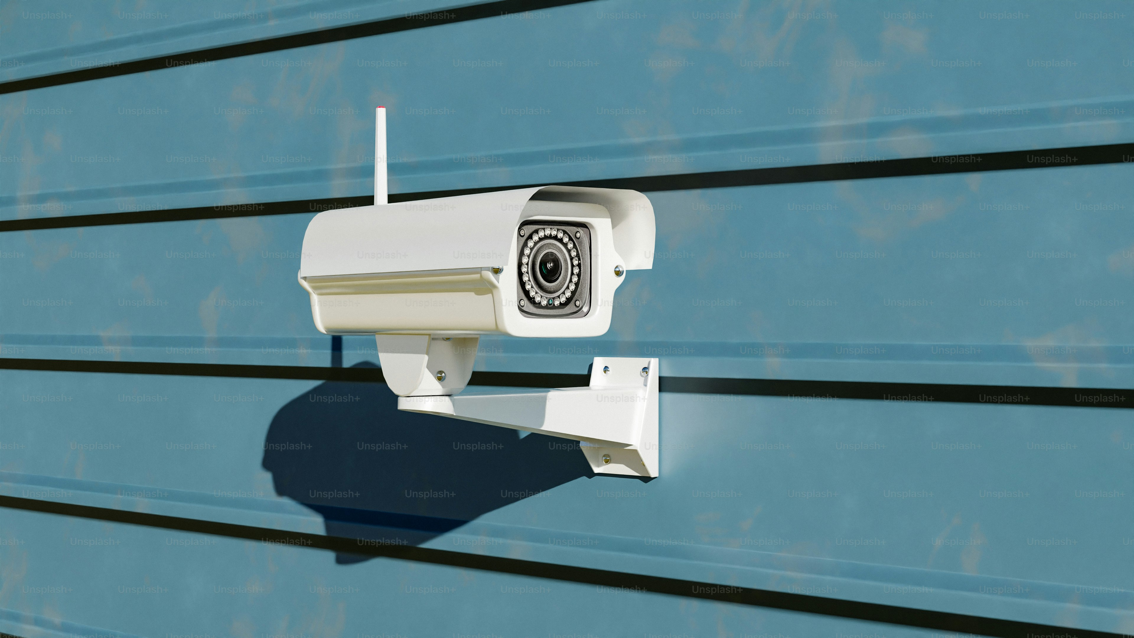 A security camera mounted on the side of a building