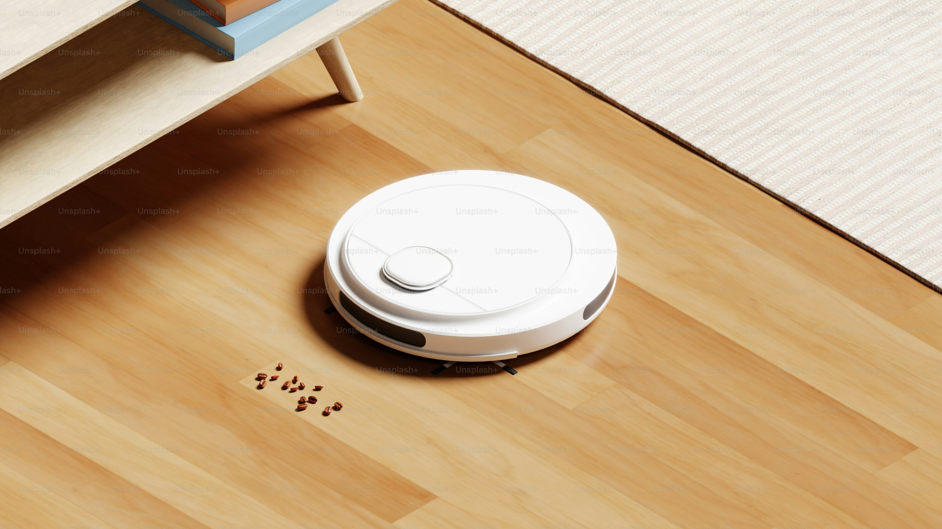 A robot vacuum on the floor next to a bed