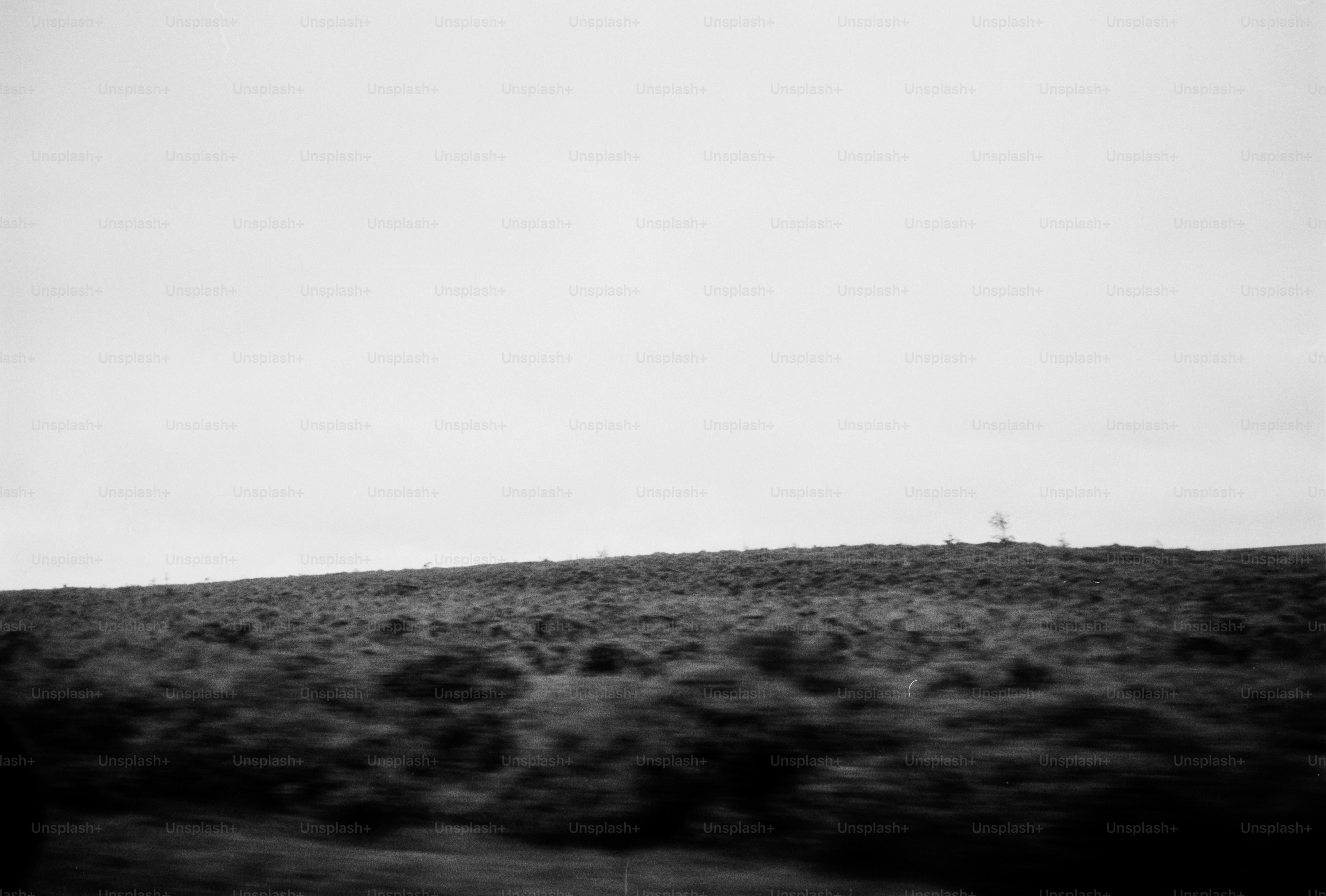 A black and white photo of a hill