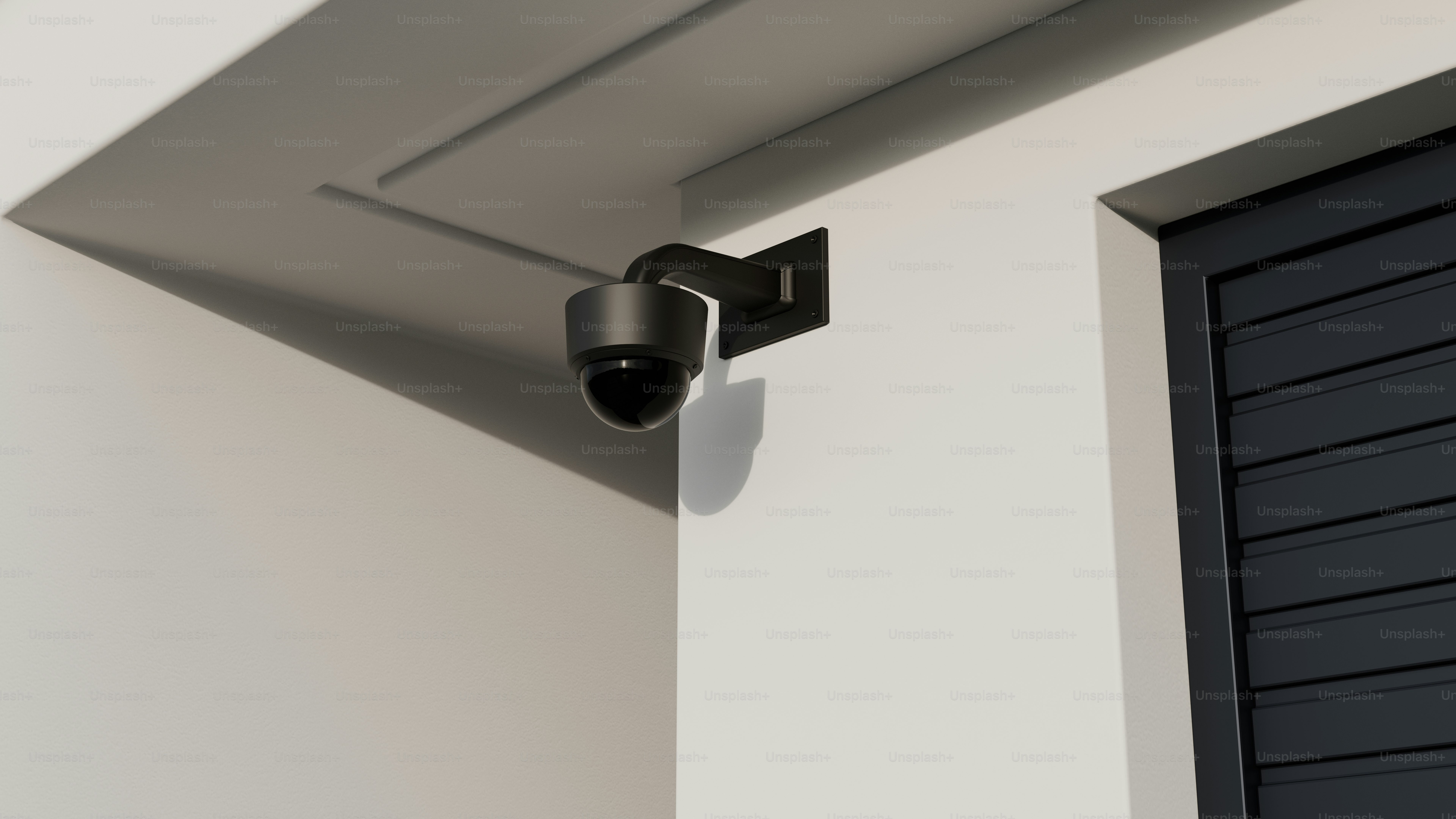 A security camera mounted to the side of a building