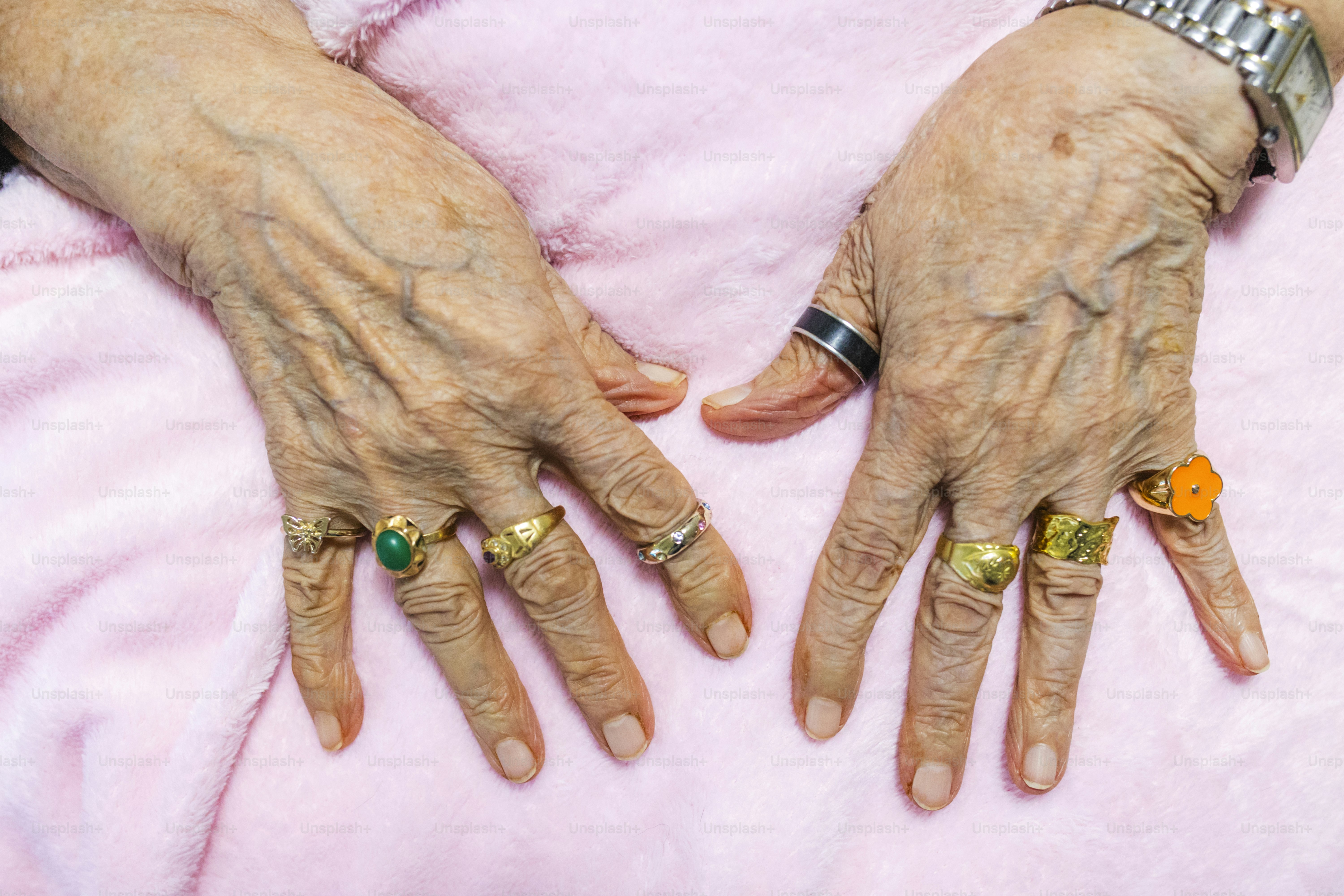 An older woman's hands with rings on them