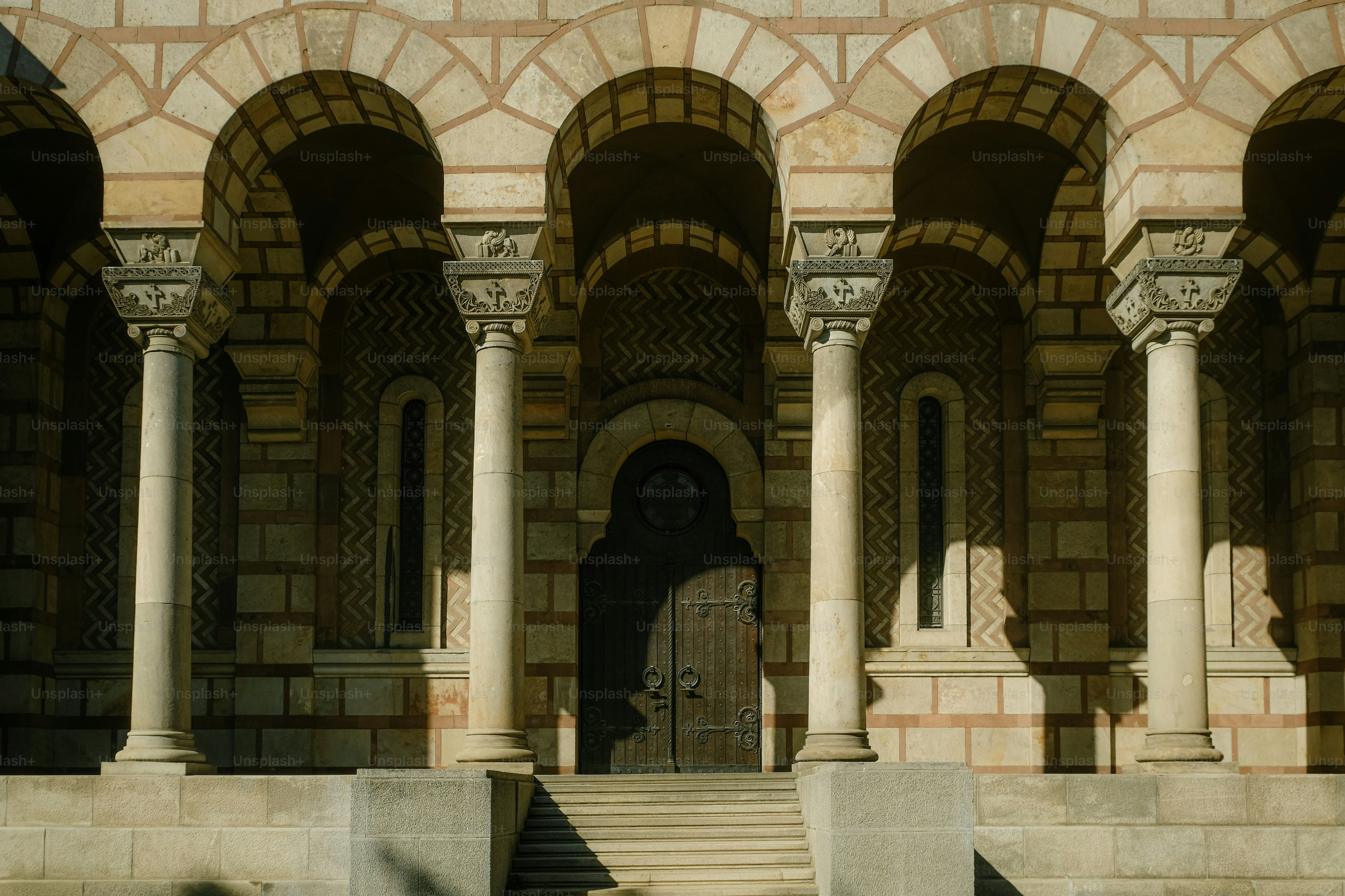 A building with columns and a clock on the front of it