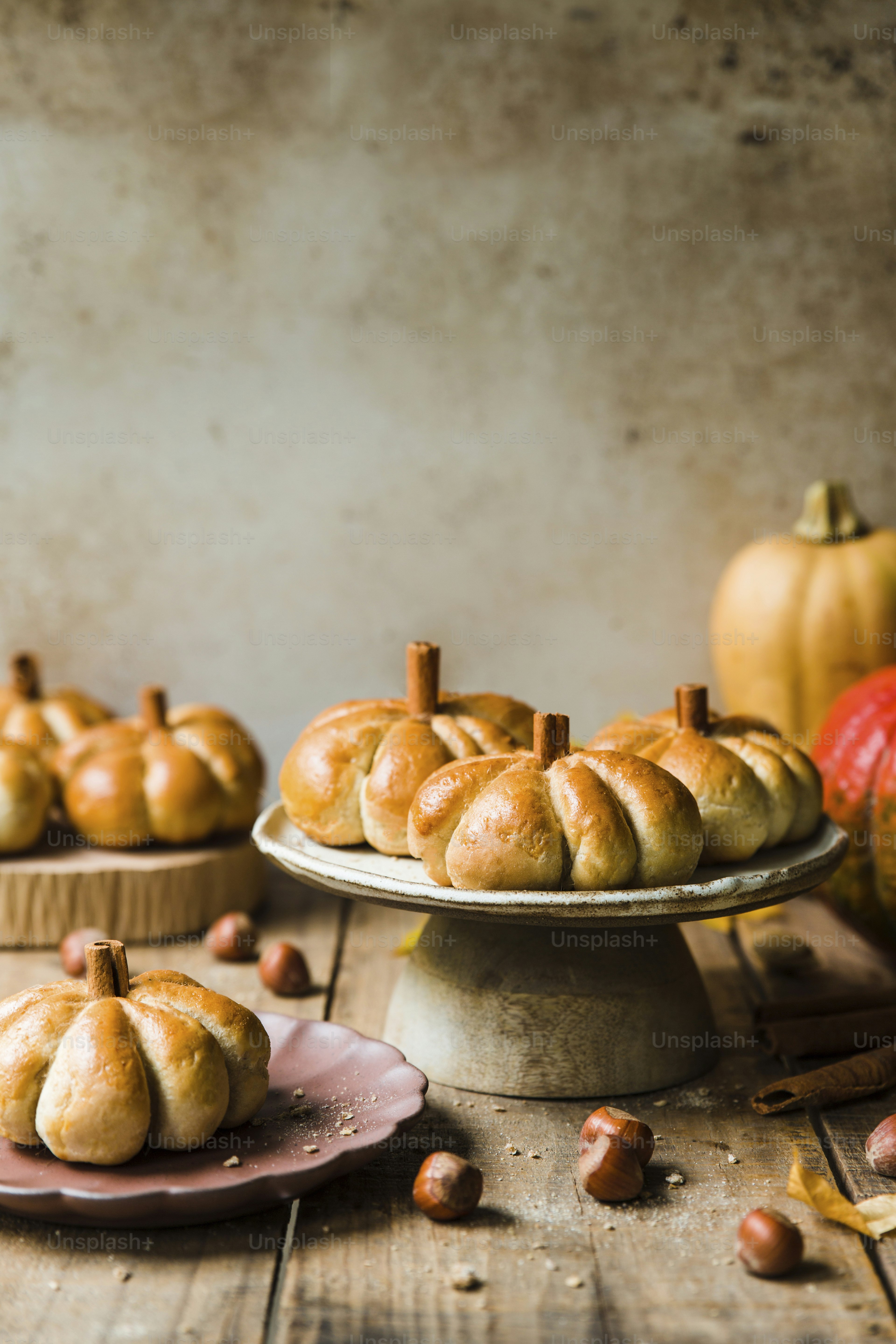 A bunch of pumpkins sitting on top of a wooden table