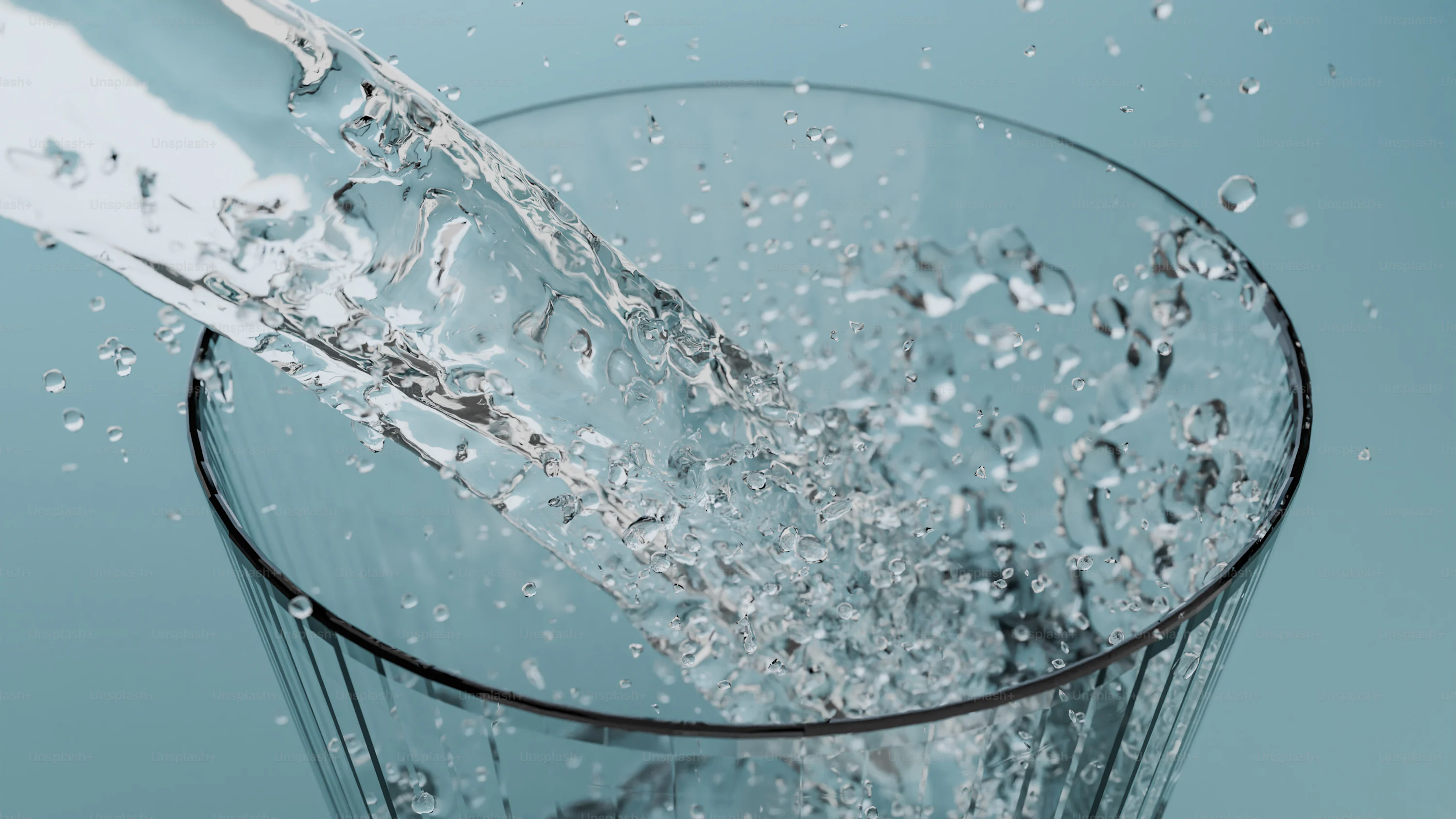 A glass filled with water on top of a table