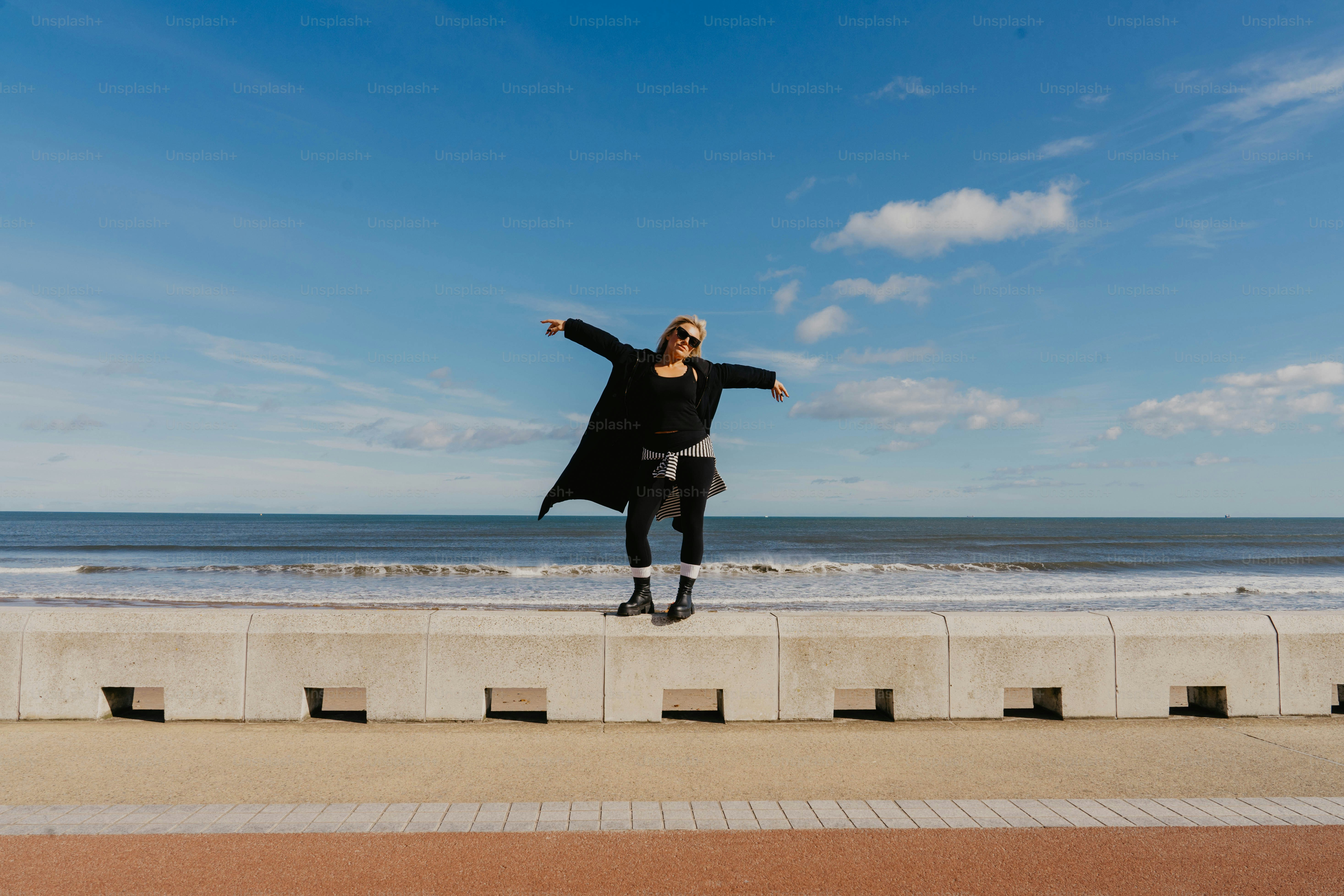 A person jumping in the air on a beach