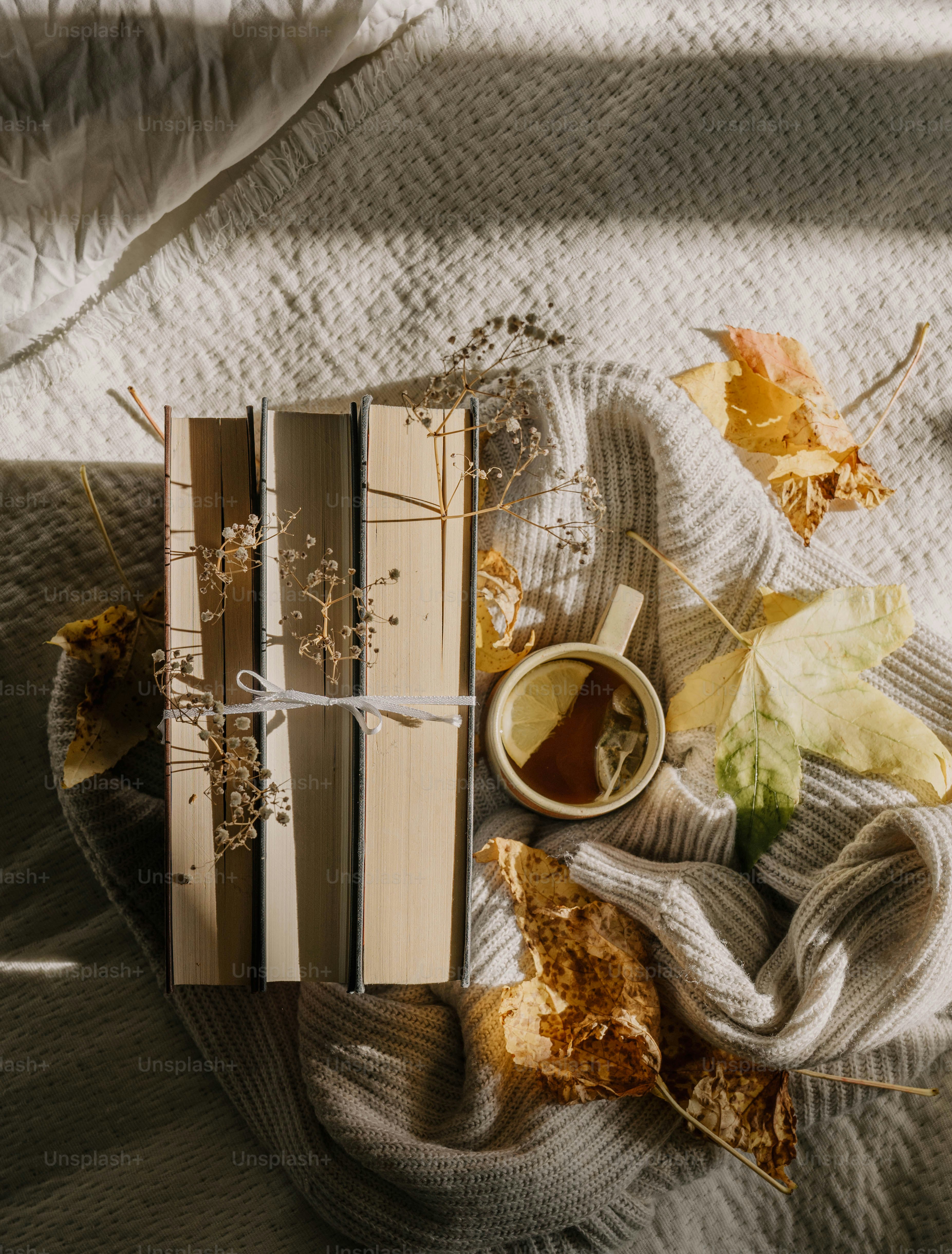A table topped with books and a cup of coffee