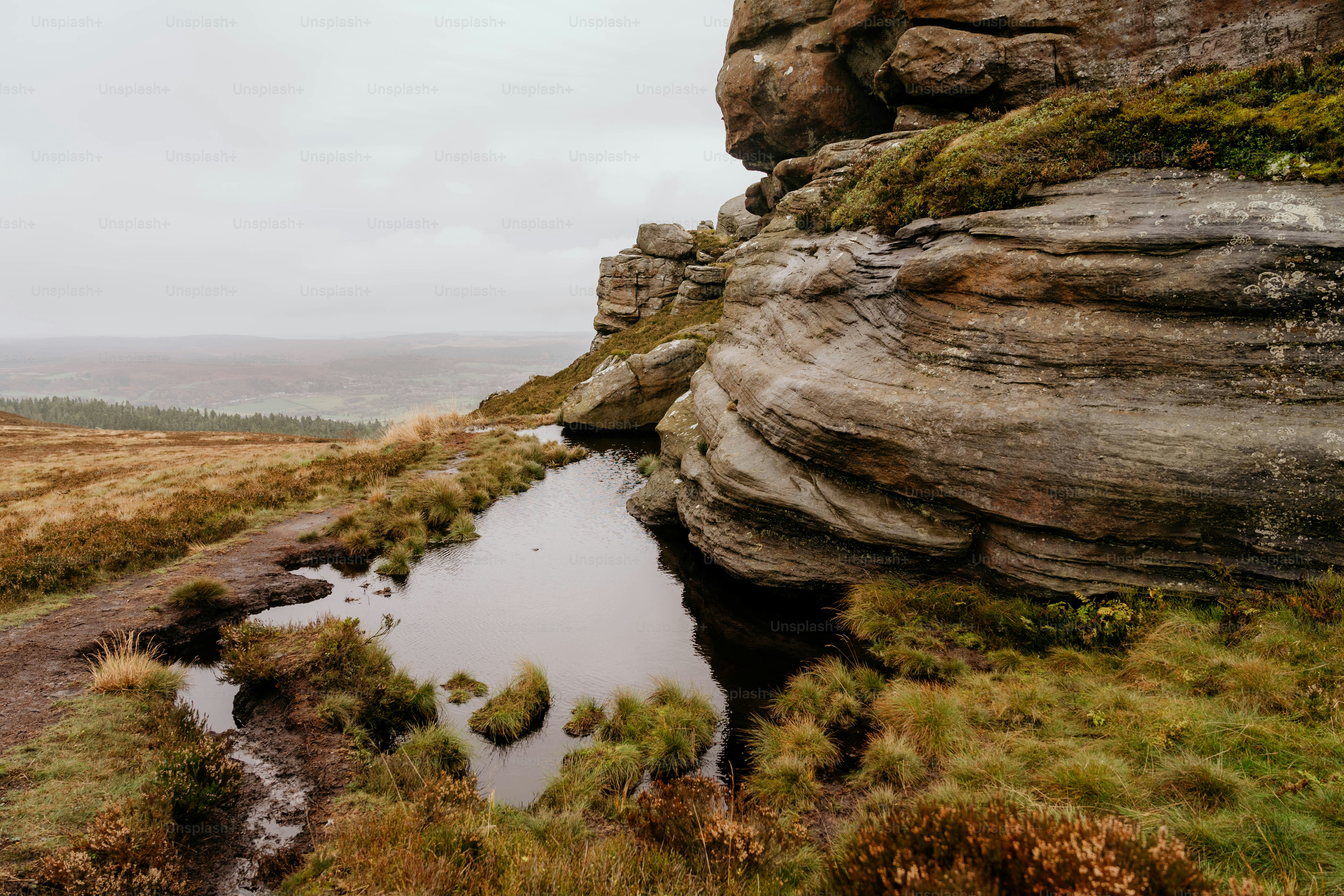 A small stream running between two large rocks