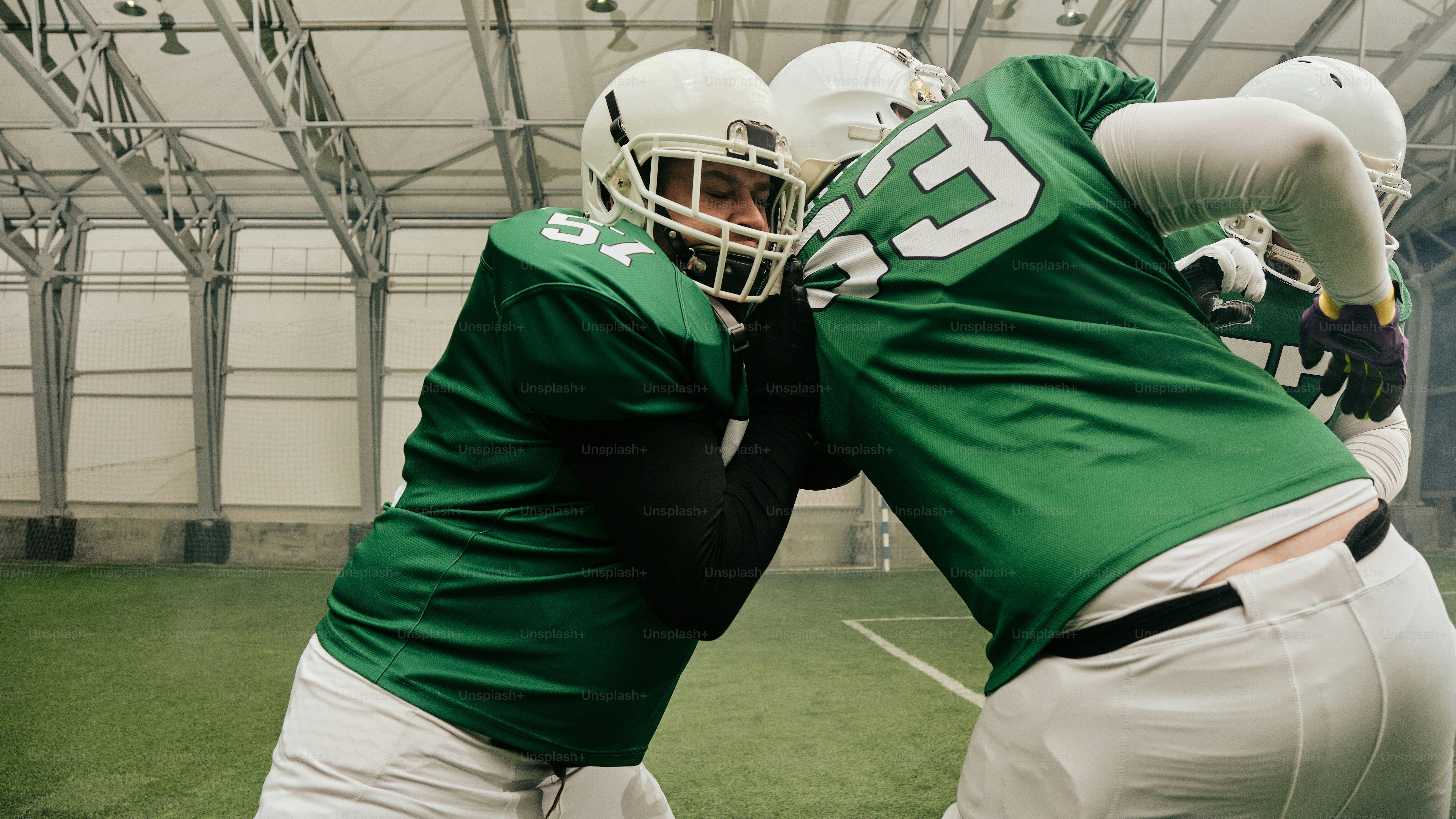 A couple of men standing next to each other on a field