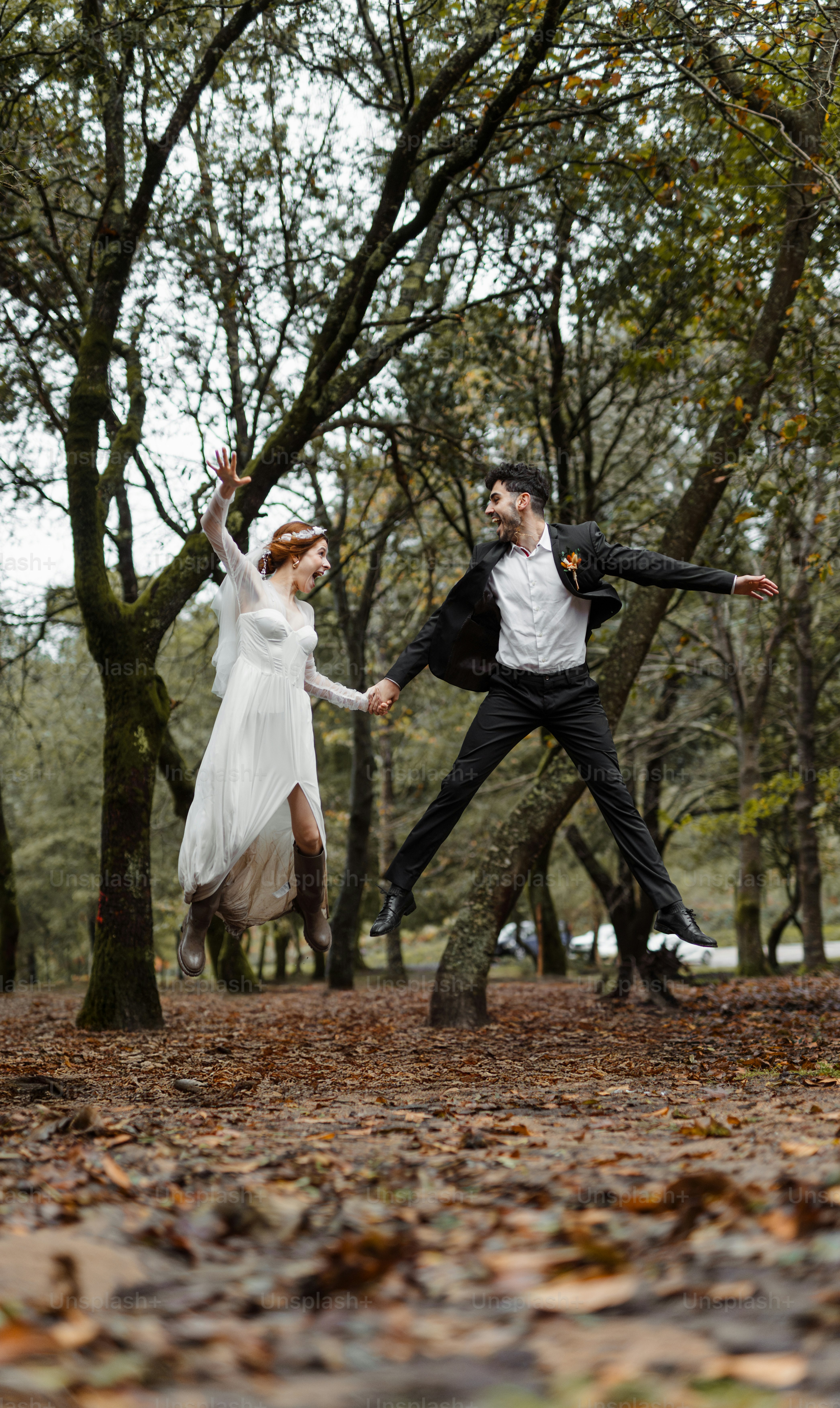 A couple of people that are jumping in the air