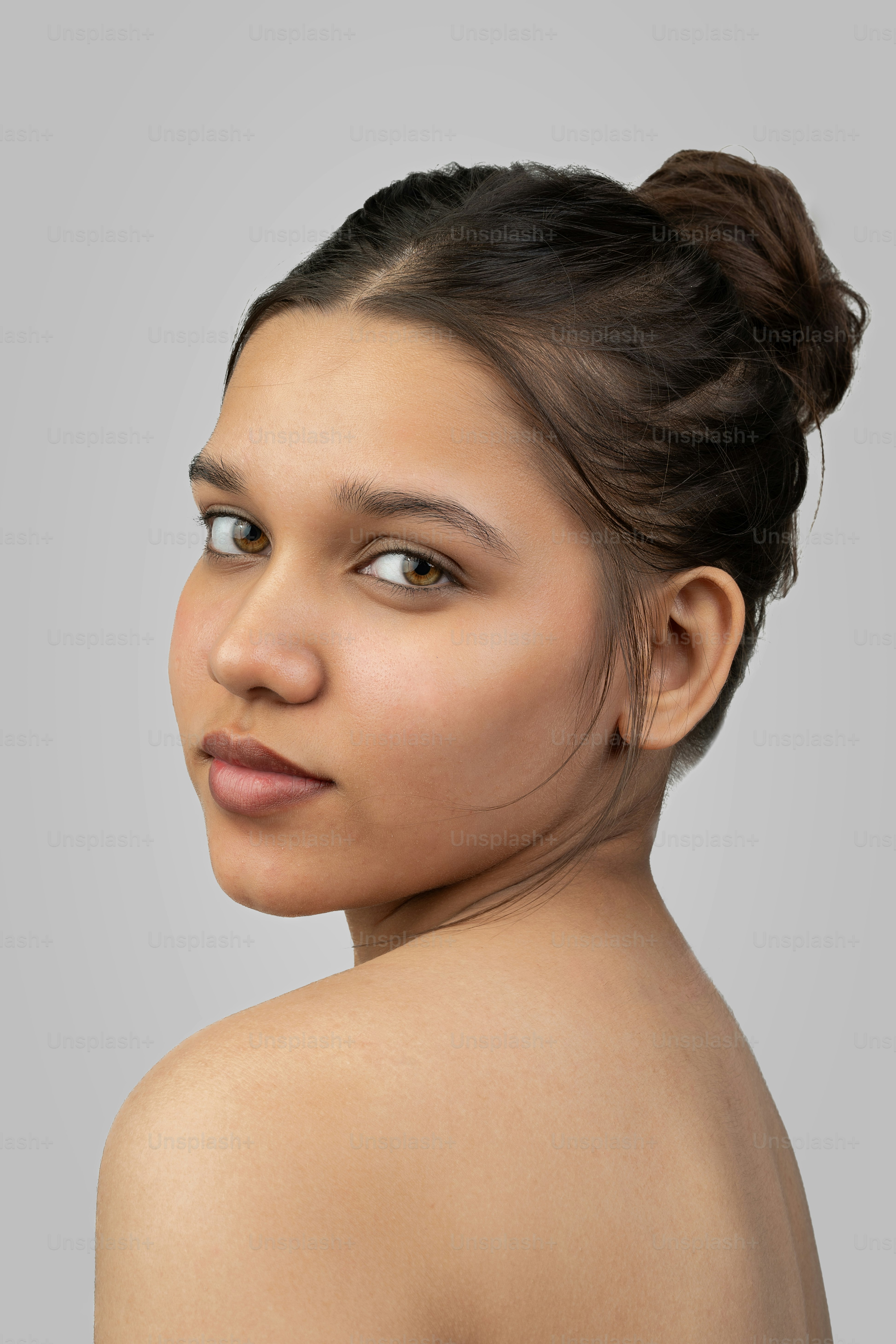 A woman with no shirt on posing for a picture