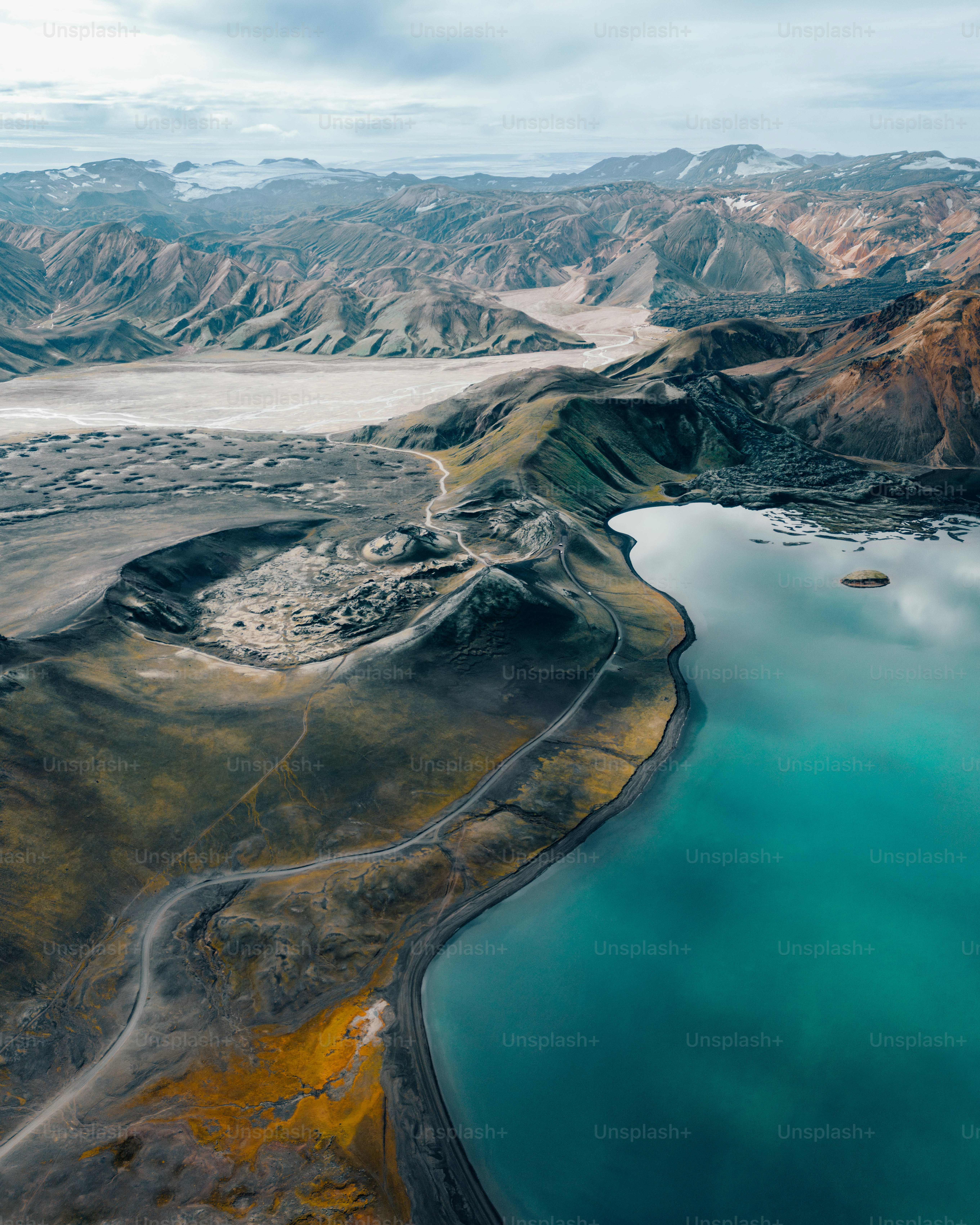 An aerial view of a snow covered mountain photo – Travel Image on Unsplash