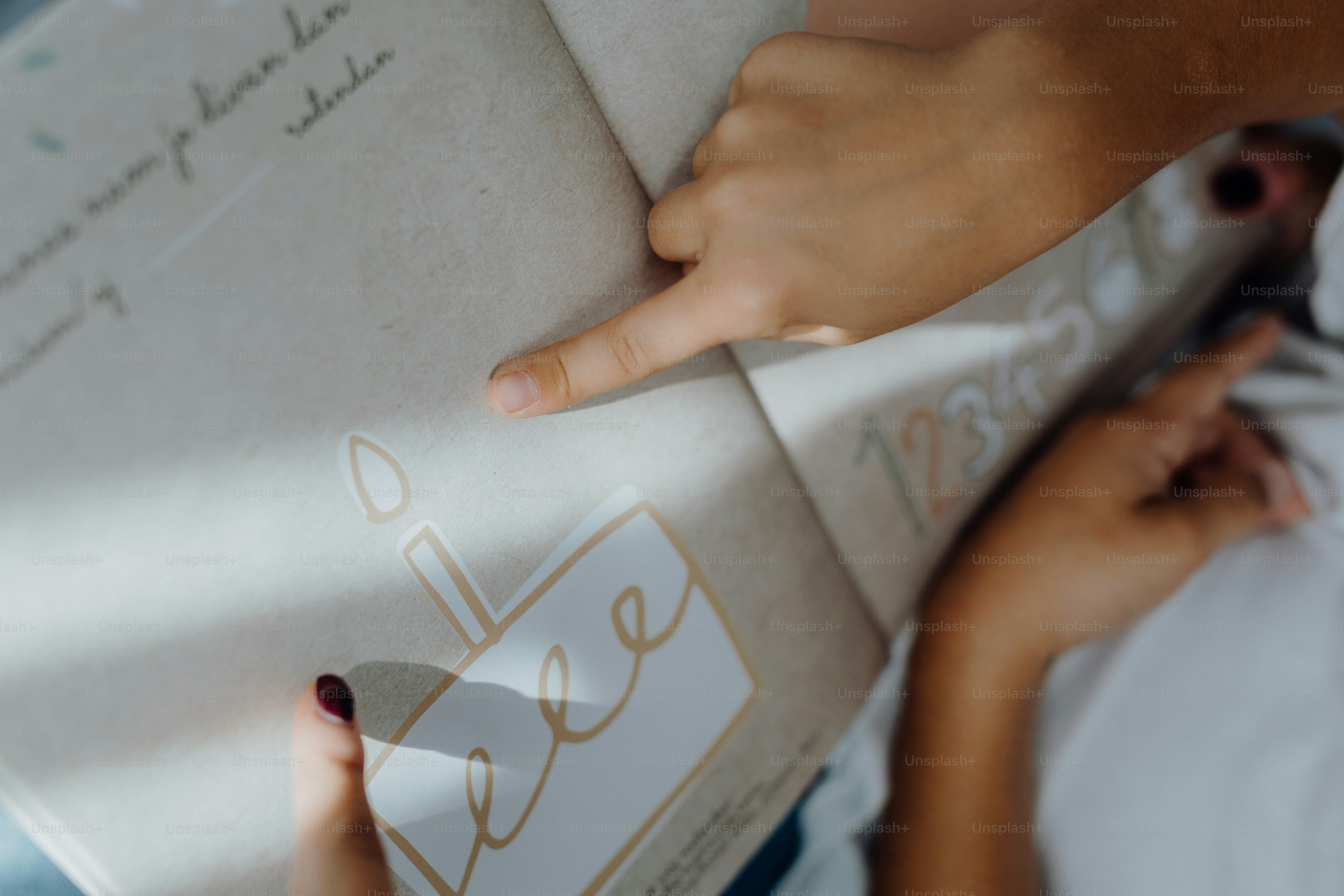 A woman is reading a book with her hand