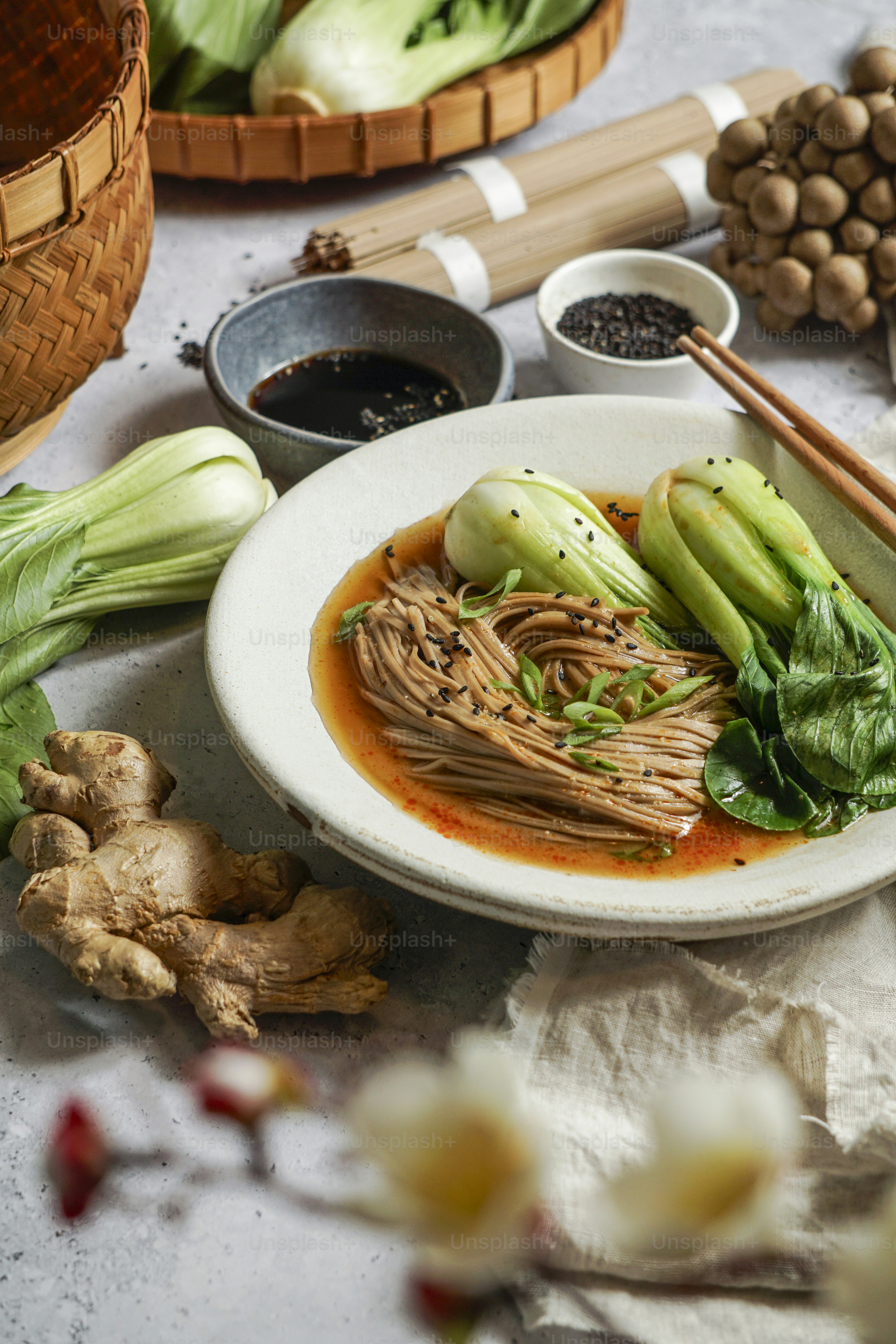 A plate of food on a table with chopsticks