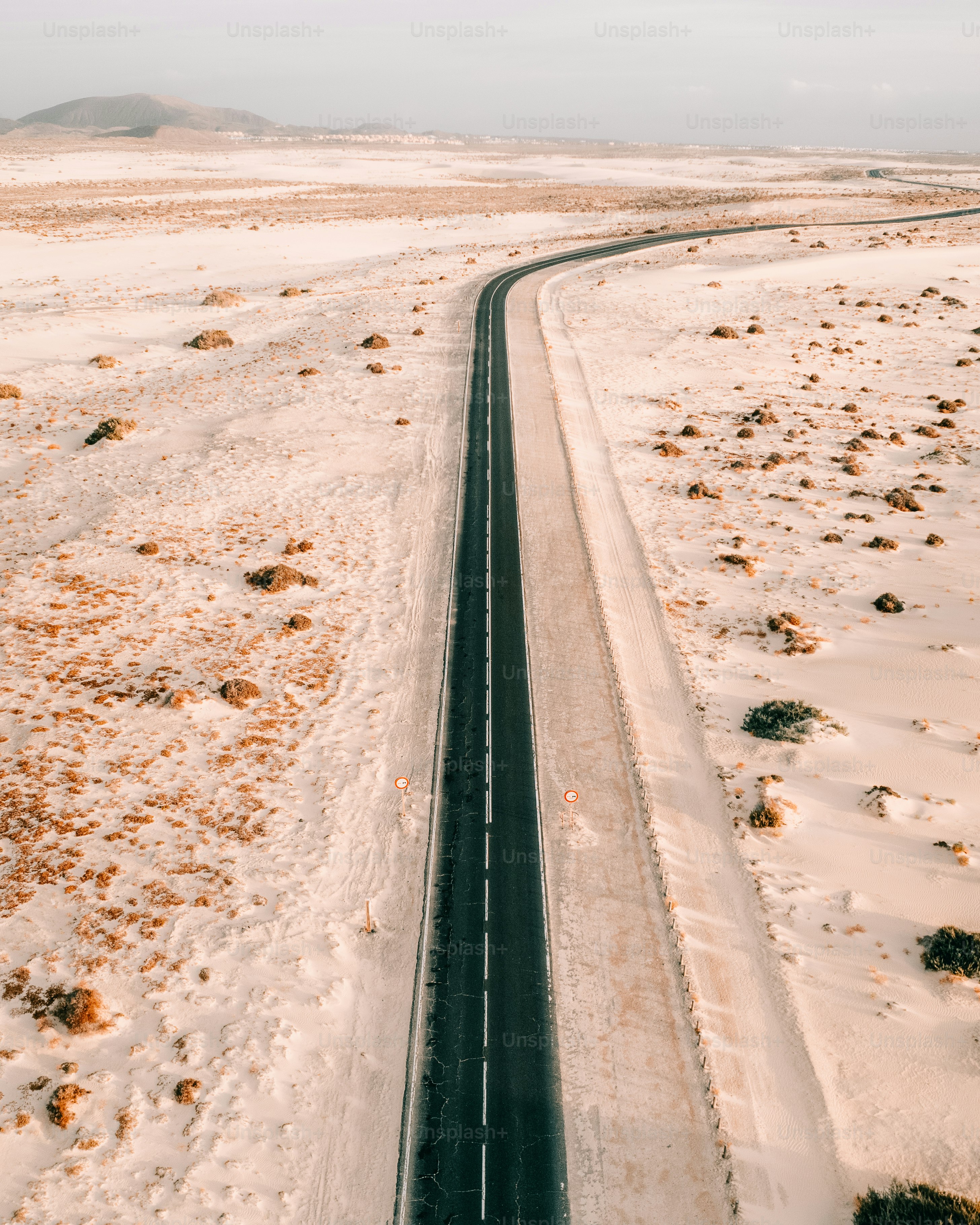 An aerial view of a road in the desert