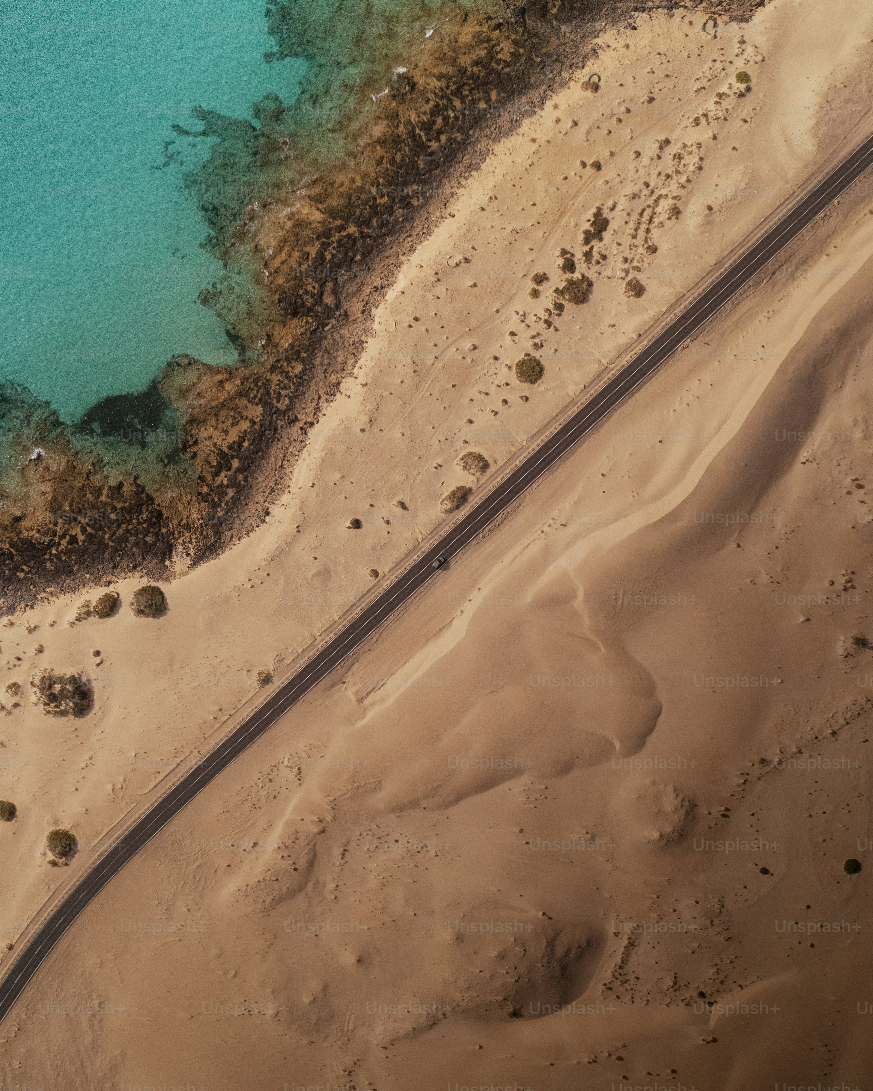 An aerial view of a beach and a body of water