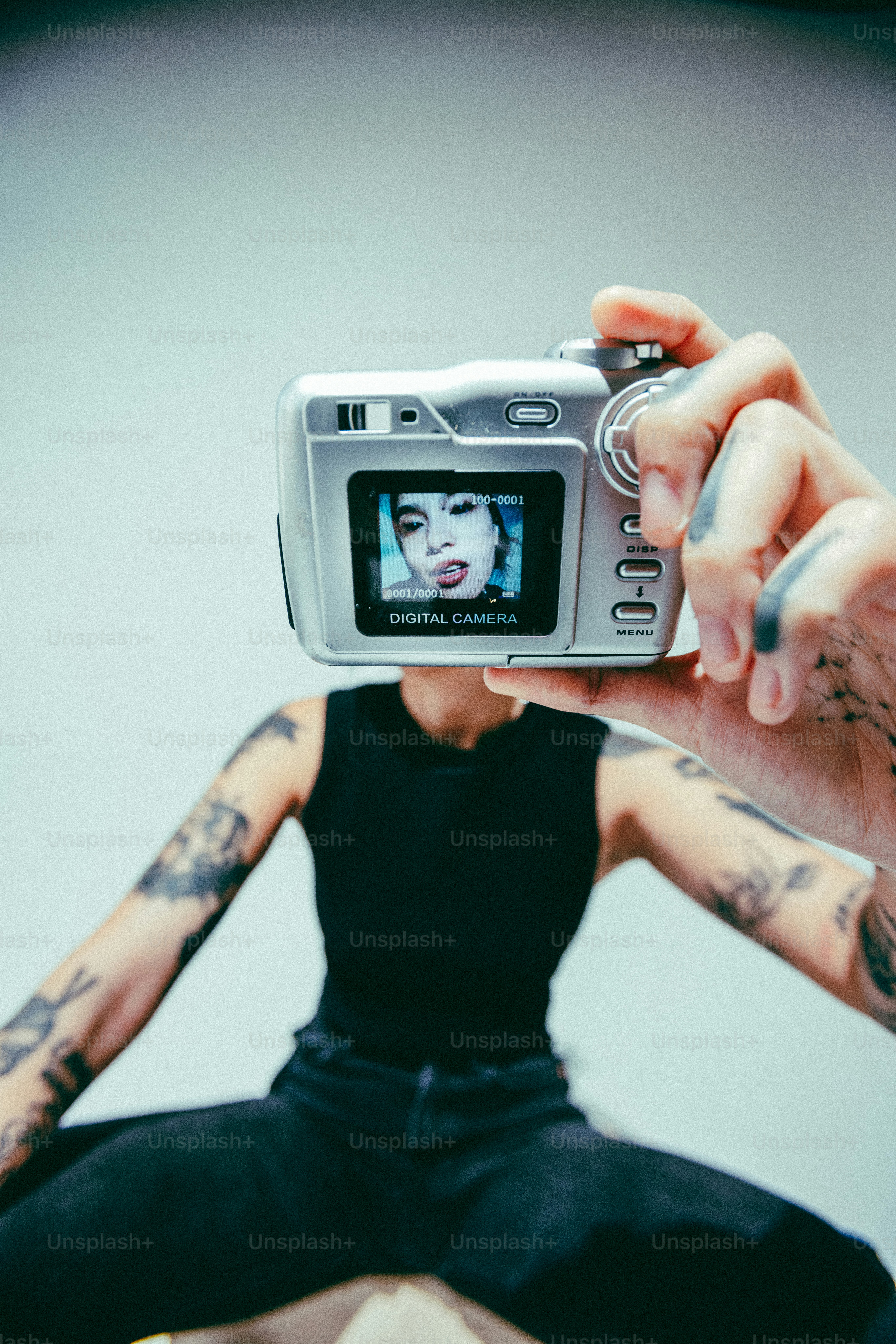 A woman taking a picture of herself with a camera