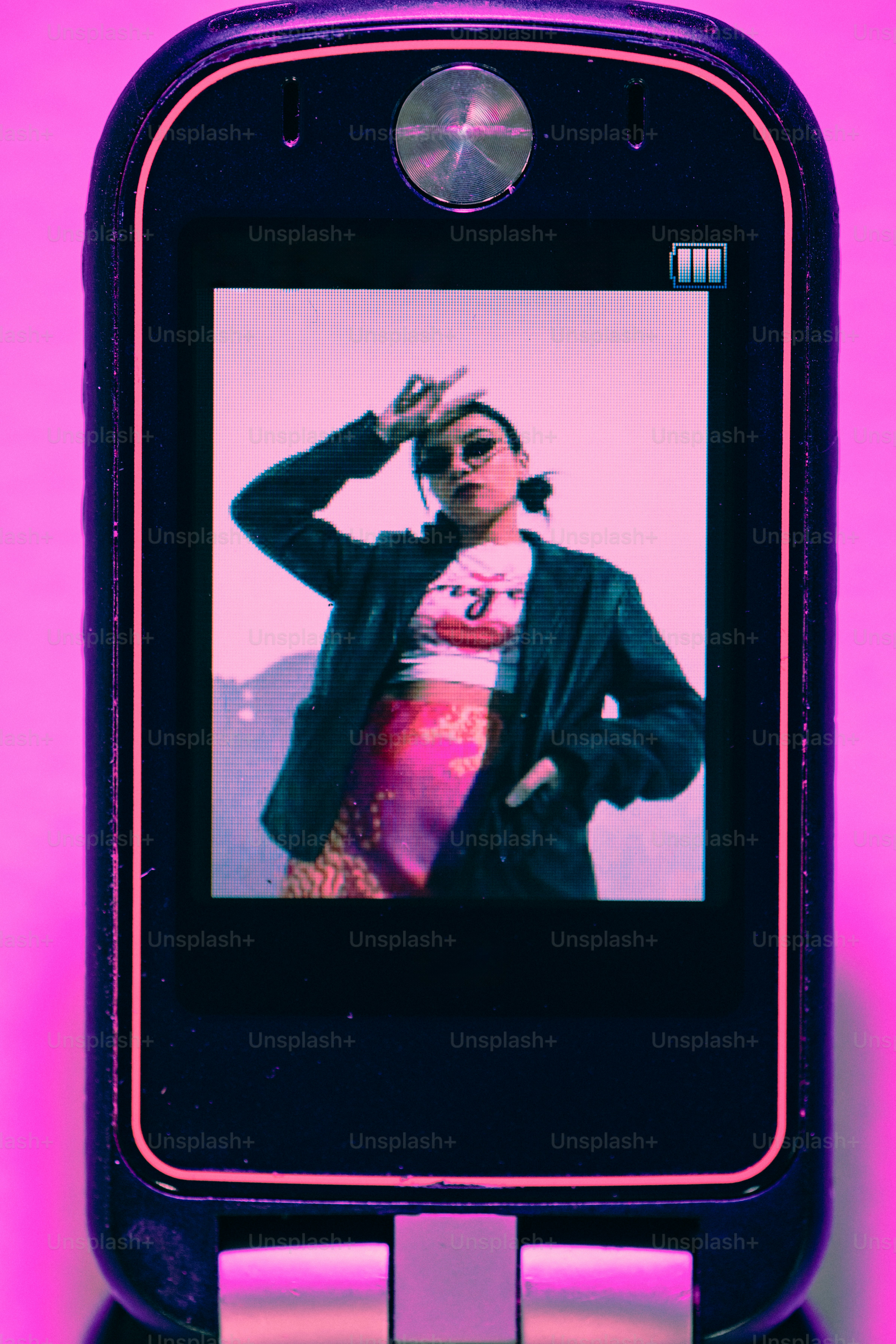 A cell phone with a picture of a woman on it