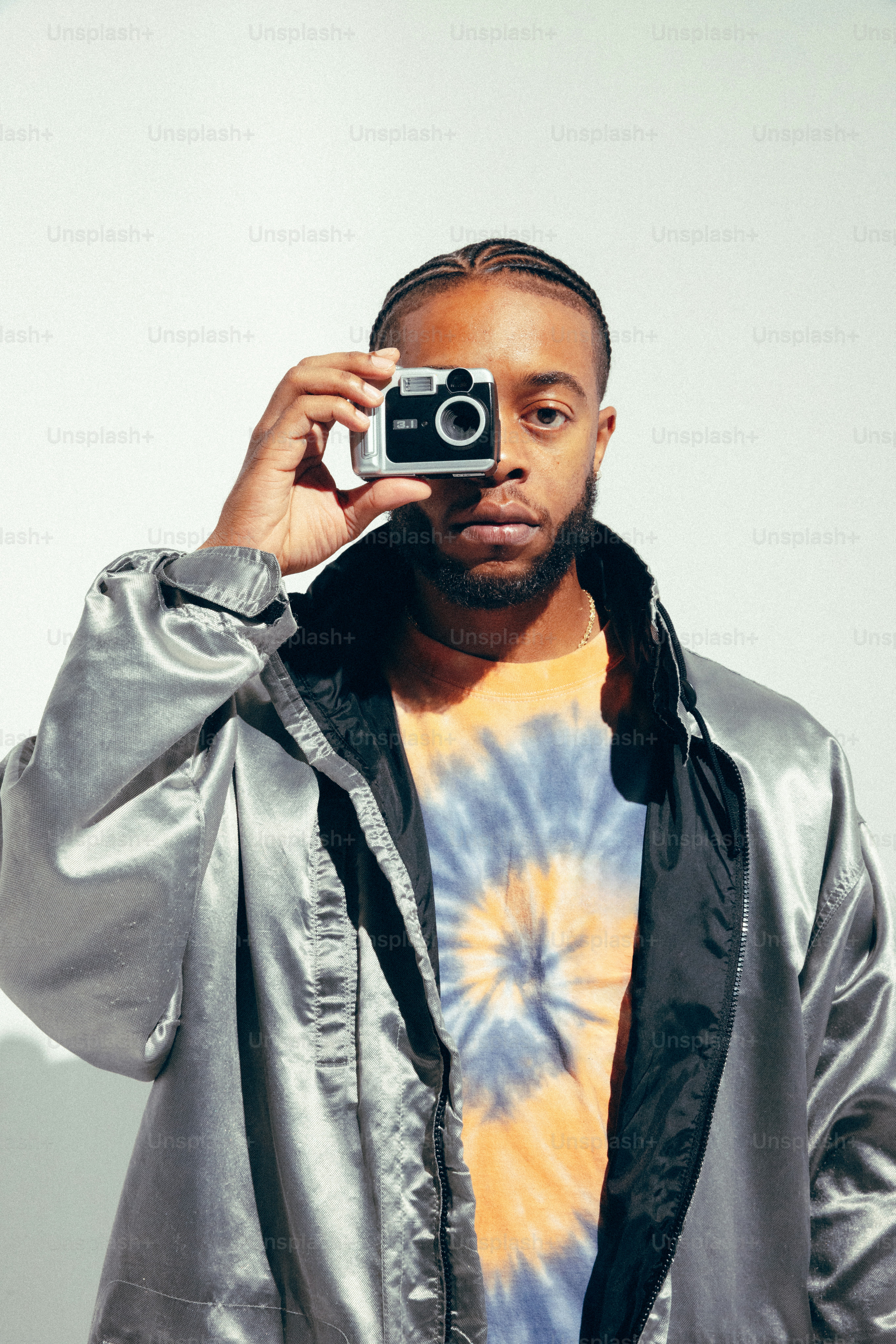 A man taking a picture of himself with a camera