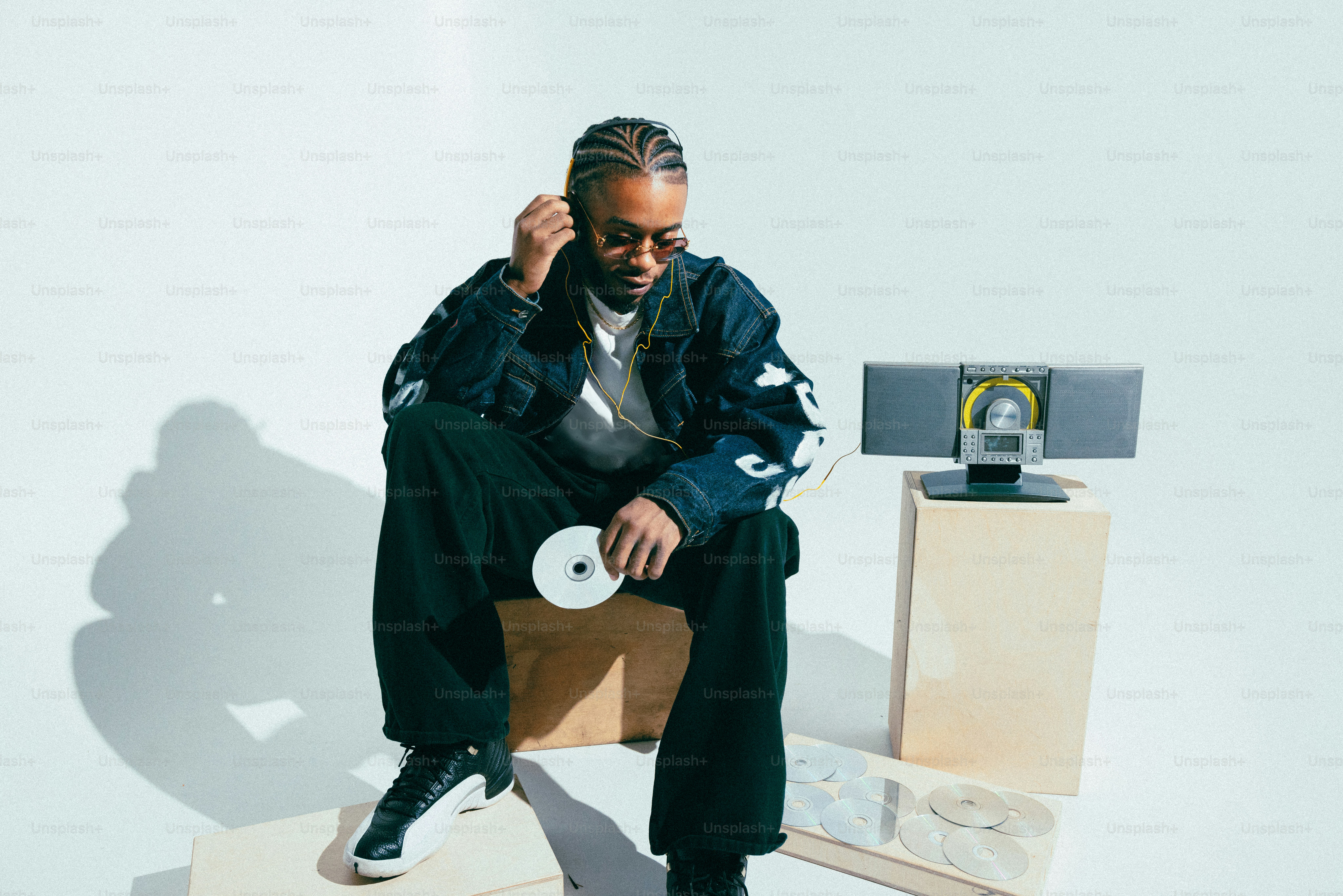 A man sitting on top of a wooden chair