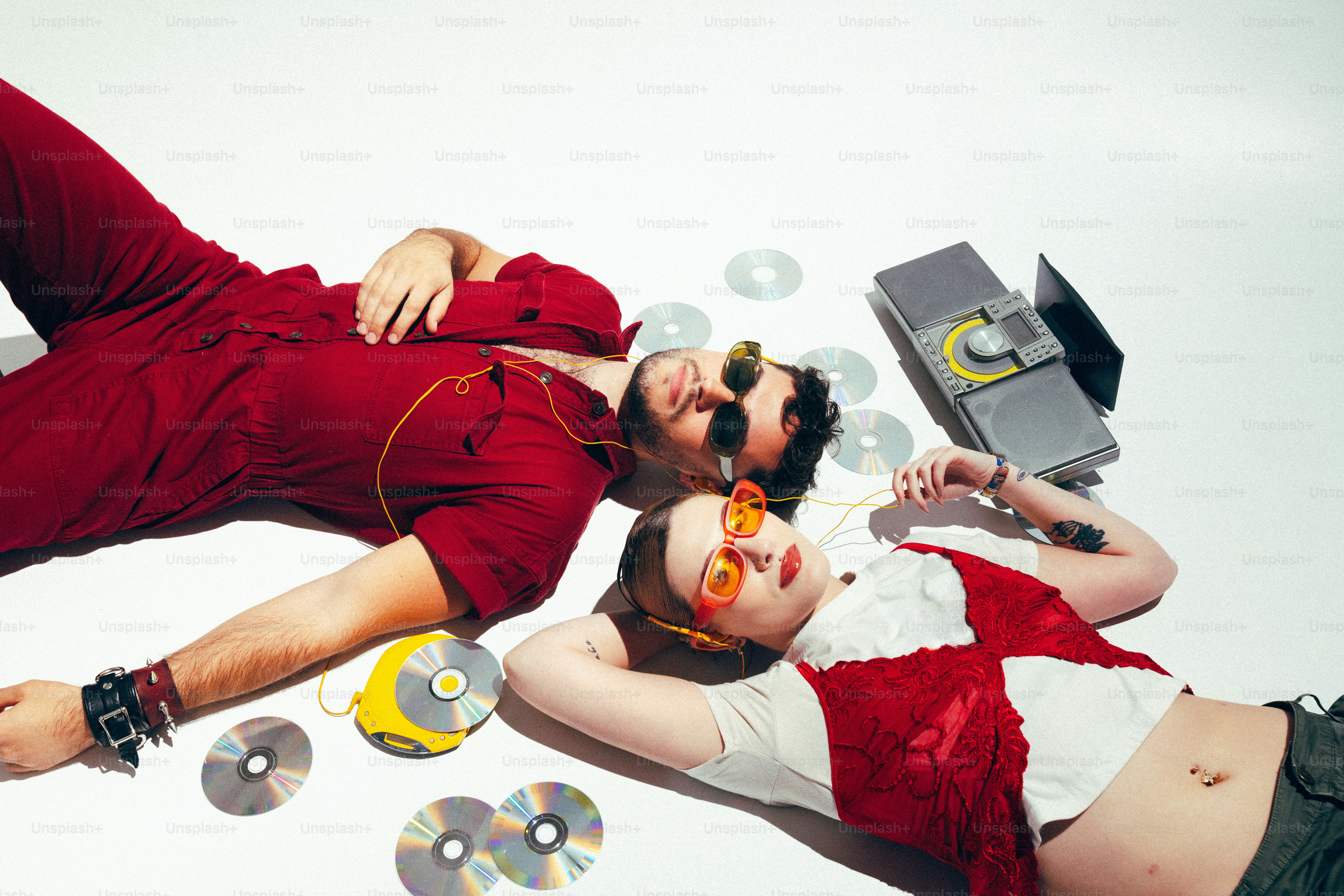 A man and a woman laying on the ground