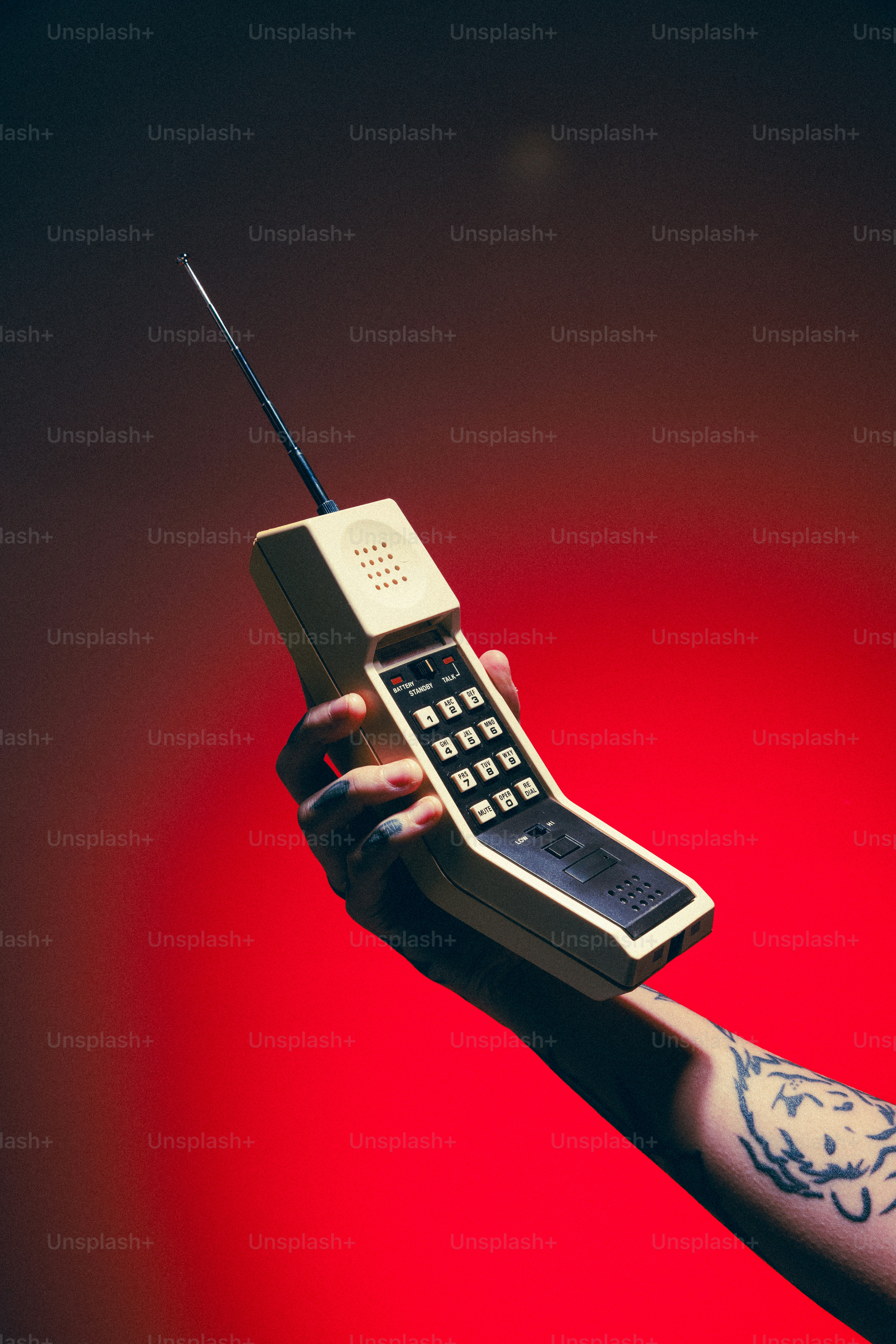A person holding a cell phone in their hand