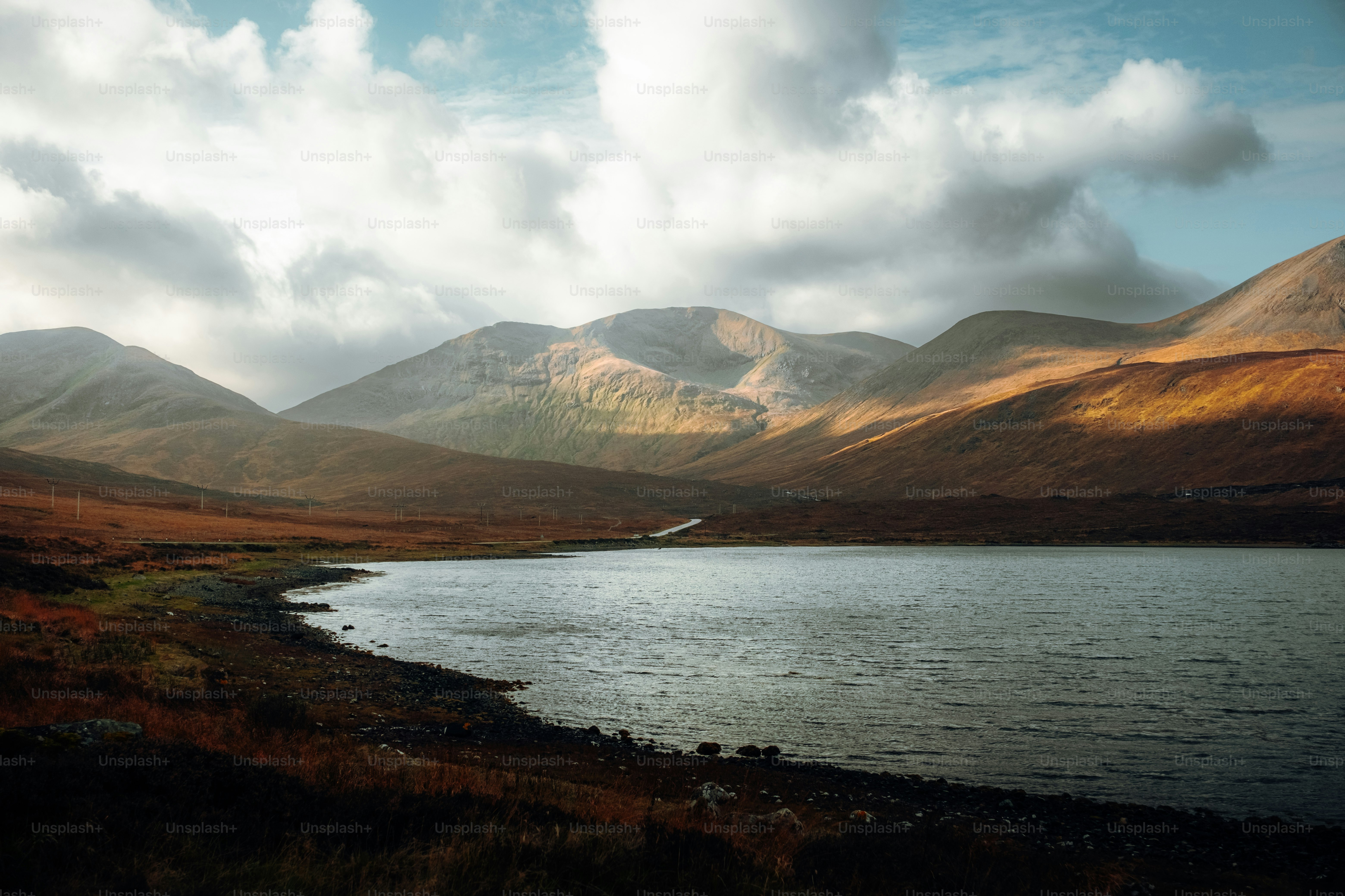 A large body of water surrounded by mountains