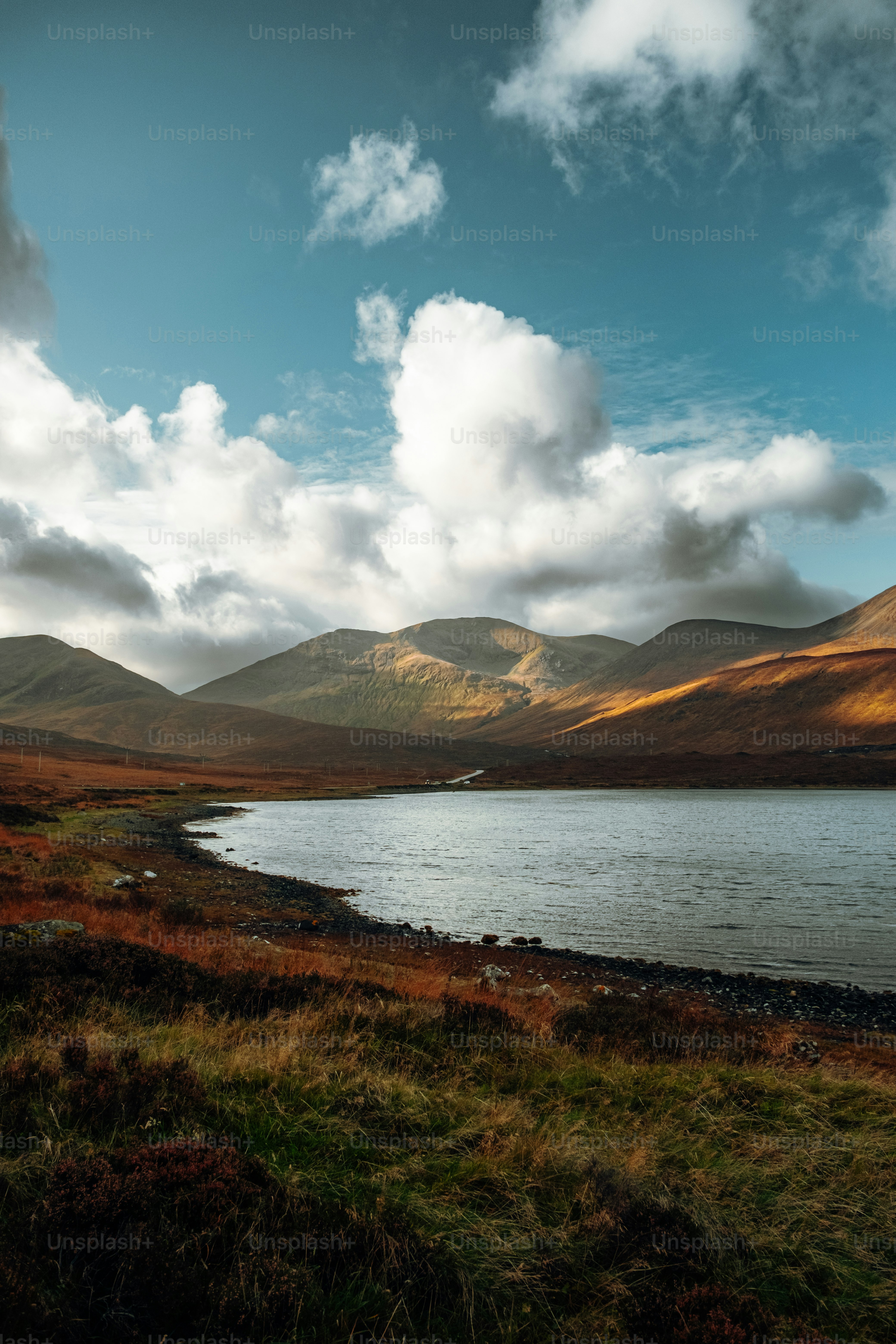 A large body of water surrounded by mountains