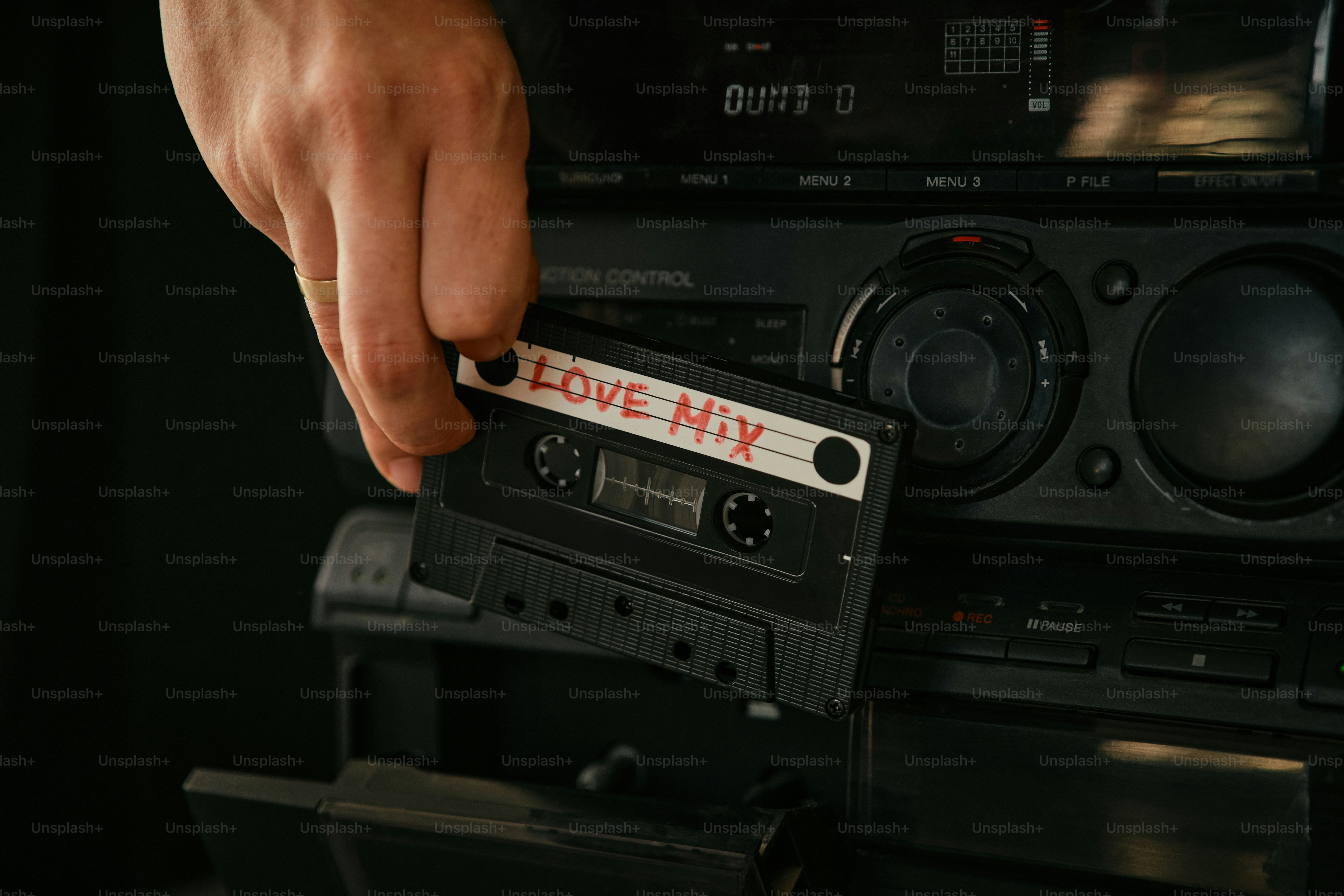 hand with audio cassette