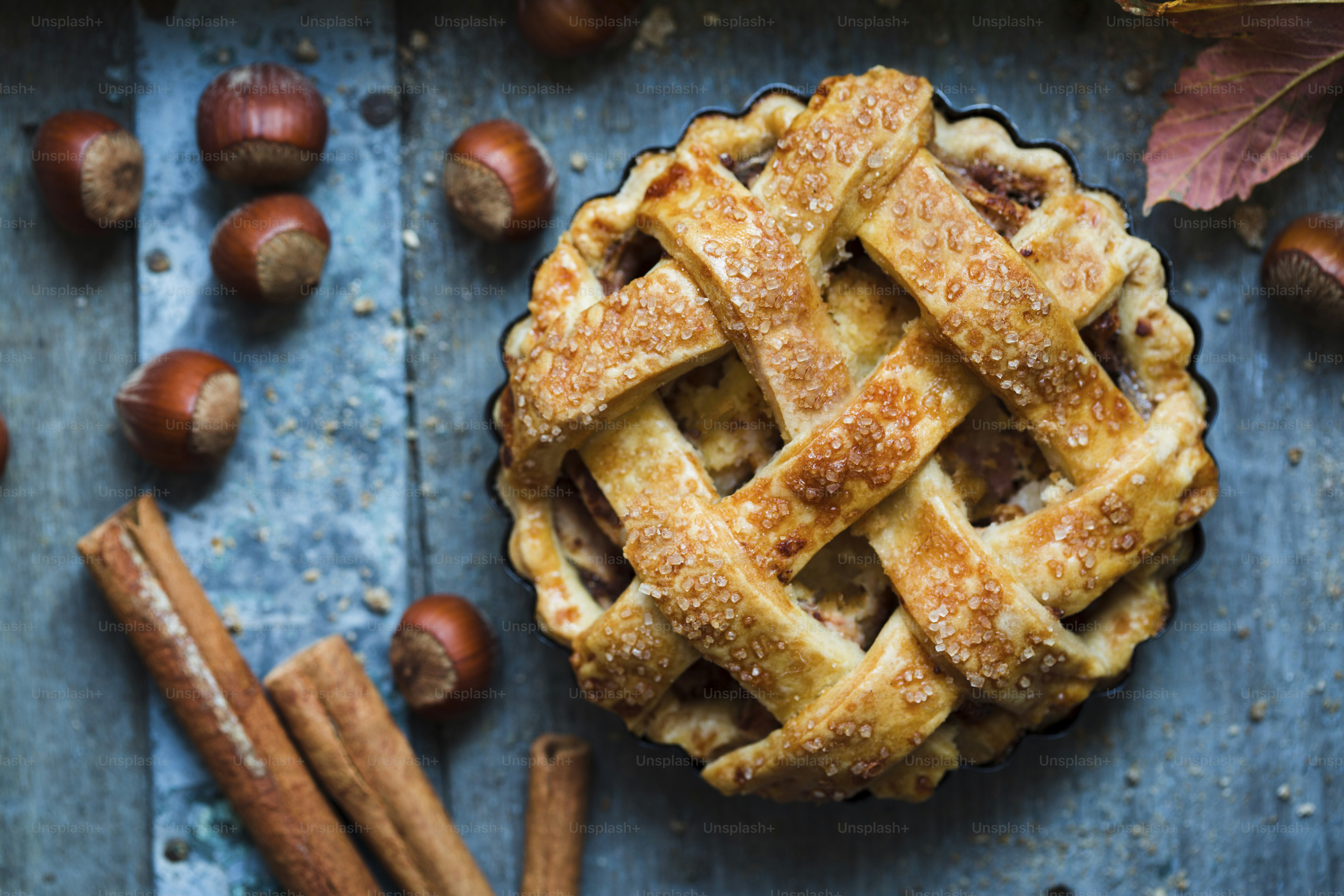 A pie sitting on top of a blue table